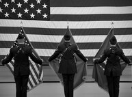 Honor guard trainees post the colors during their graduation at Fairchild Air Force Base, Wash., Jan. 10, 2013. A colors presentation has a team of four members; U.S. flag bearer, military branch flag bearer, and two rifle bearers serve as protectors of the colors. In some cases, a fifth member is requested to present the state flag at ceremonies throughout the community. (U.S. Air Force photo illustration by Senior Airman Taylor Curry)