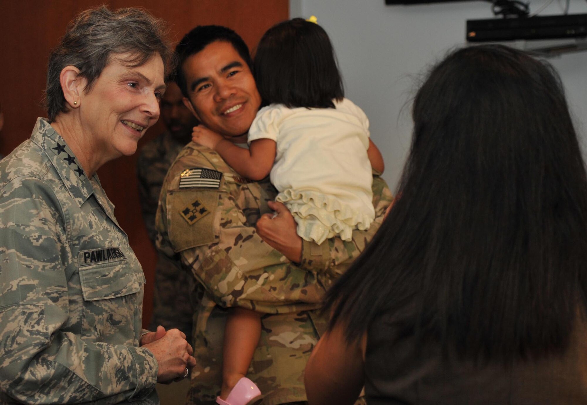 SMC Commander, Lt. Gen. Ellen Pawlikowski, talks with returning airmen and their families prior to the start of the Welcome Home Airmen ceremony, Jan. 24.  The ceremony honored airmen returning from deployments during the past six months.  (Photo by Sarah Corrice)
