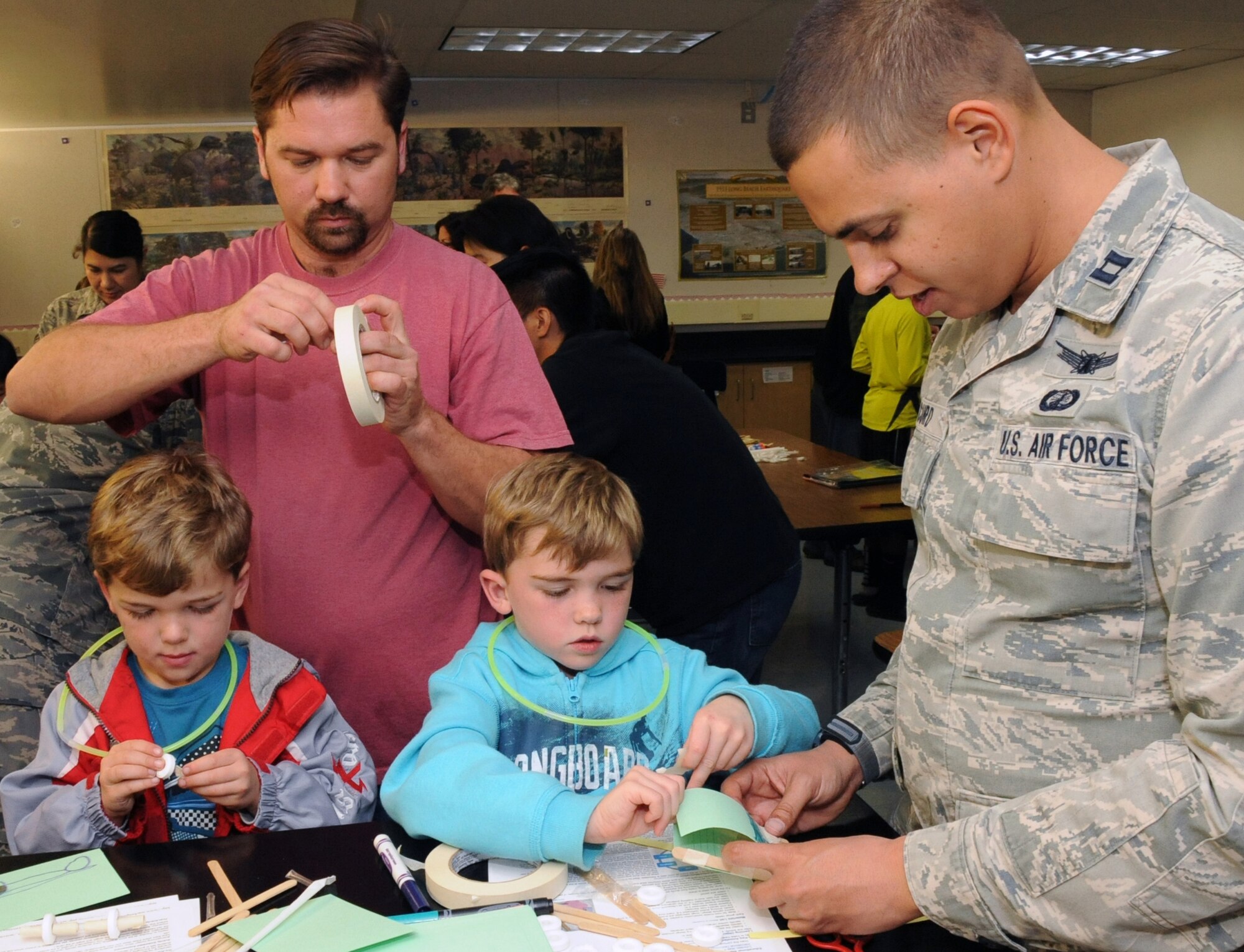 Volunteers help students build a vehicle using paper, popsicle sticks and mints at a Science, Technology, Engineering and Mathematics (STEM) event, Jan. 23.  The event was held at Richmond Street School in El Segundo. (Photo by Jim Gordon)