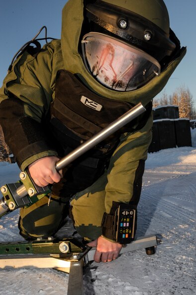 U.S. Air Force Airman 1st Class Kyle Fletcher, 354th Civil Engineer Squadron explosive ordinance disposal apprentice, deploys a Percussion Actuated Neutralizer Jan. 22, 2013, Eielson Air Force Base, Alaska.  The PAN is a versatile projectile launcher utilizing an array of ammunition such as steel shots, metal slugs or water to detonate explosive ordinance while the operator stays a safe distance from the blast.  (U.S. Air Force Photo/Airman 1st Class Peter Reft)