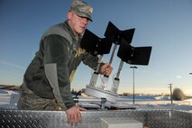 U.S. Air Force Airman 1st Class Kyle Fletcher, 354th Civil Engineer Squadron explosive ordinance disposal apprentice, places an F6A robot control antennae on the roof of a Base Support Emergency Response Vehicle Jan. 22, 2013, Eielson Air Force Base, Alaska.  The BSERVE is a mobile command unit enabling EOD members to respond at a moment’s notice to a wide variety of explosive threats.  (U.S. Air Force Photo/Airman 1st Class Peter Reft)