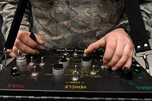 U.S. Air Force Airman 1st Class Kyle Fletcher, 354th Civil Engineer Squadron explosive ordinance disposal apprentice, operates an F6A robot control panel Jan. 22, 2013, Eielson Air Force Base, Alaska.  Fletcher maintains and operates EOD equipment for the 354th CES.  (U.S. Air Force Photo/Airman 1st Class Peter Reft)