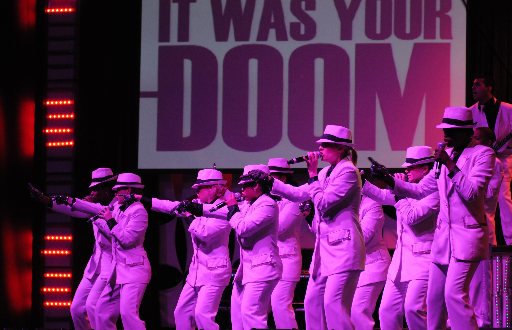 Members of the Tops in Blue 2012 World Tour perform the song ‘Smooth Criminal’ by Michael Jackson Jan. 27, 2013, at the Mississippi Coast Coliseum.  Hundreds of Keesler Airmen, families and community members watched and listened as the sequin-studded members of Tops in Blue performed their diverse show. According to its website, Tops in Blue began in 1953 and has since performed on film, on national television and at events like the Super Bowl and World’s Fair. This year’s tour takes the group to more than 20 countries with nearly 130 performances. For more information on the team or audition requirements, visit www.topsinblue.com.  (U.S. Air Force photo by Kemberly Groue)