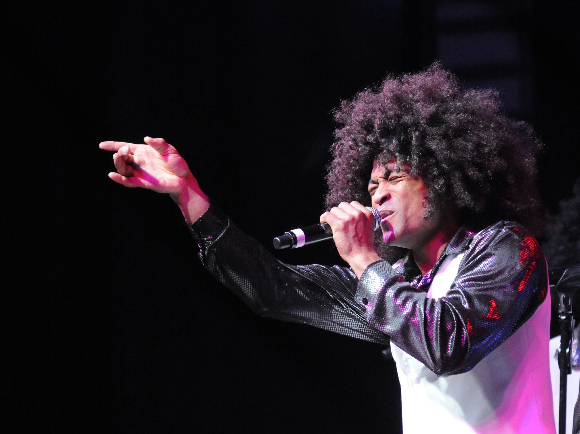 Senior Airman Charles Cooper, Ramstein Air Base, Germany, portrays Michael Jackson as he sings the song “ABC” by the Jackson 5 during the Tops in Blue 2012 World Tour Jan. 27, 2013, at the Mississippi Coast Coliseum.  Hundreds of Keesler Airmen, families and community members watched and listened as the sequin-studded members of Tops in Blue performed their diverse show. According to its website, Tops in Blue began in 1953 and has since performed on film, on national television and at events like the Super Bowl and World’s Fair. This year’s tour takes the group to more than 20 countries with nearly 130 performances. For more information on the team or audition requirements, visit www.topsinblue.com.  (U.S. Air Force photo by Kemberly Groue)