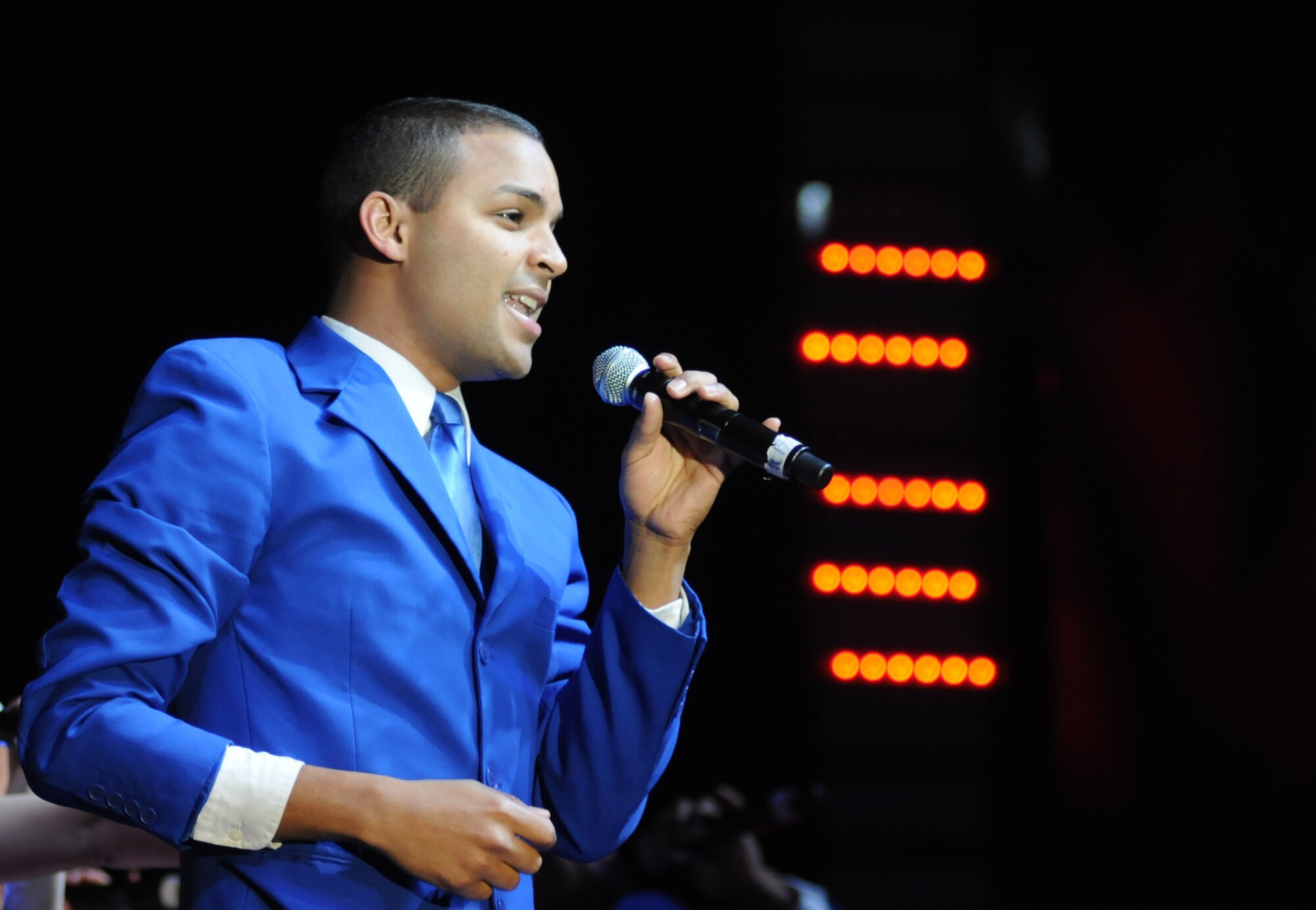Senior Airman Emmanuel Maldonado Rosario, 81st Dental Squadron, performs with the Tops in Blue during their 2012 World Tour Jan. 27, 2013, at the Mississippi Coast Coliseum.  Hundreds of Keesler Airmen, families and community members watched and listened as the sequin-studded members of Tops in Blue performed their diverse show. According to its website, Tops in Blue began in 1953 and has since performed on film, on national television and at events like the Super Bowl and World’s Fair. This year’s tour takes the group to more than 20 countries with nearly 130 performances. For more information on the team or audition requirements, visit www.topsinblue.com.  (U.S. Air Force photo by Kemberly Groue)