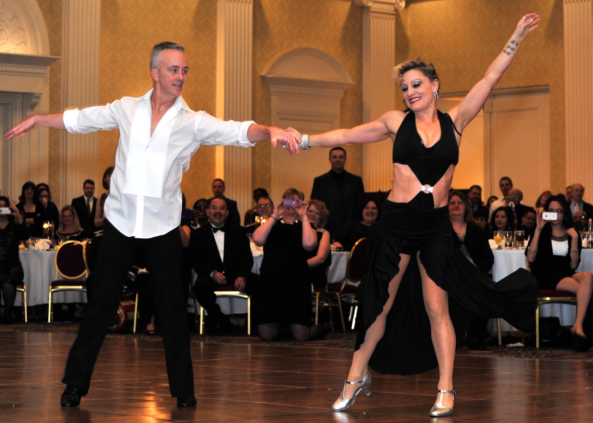 Col. Kevin Murphy, 436th Medical Group commander, dances with his partner Shonelle Graulich during the Dancing with the Delaware Stars competition Jan. 26, 2013, at Dover Downs in Dover, Del. Murphy and Graulich finished in second place in the benefit for the Mom’s House in Dover.  The Mom’s House offers single parents the opportunity to continue their education by providing childcare services free of charge. Dancing with the Delaware Stars is a judged dance contest which community leaders throughout Delaware seek to generate revenue through ticket sales. The non-profit organization does not accept government funding; their primary source of funding is through the dance contest. (U.S. Air Force photo by Tech. Sgt. Chuck Walker)