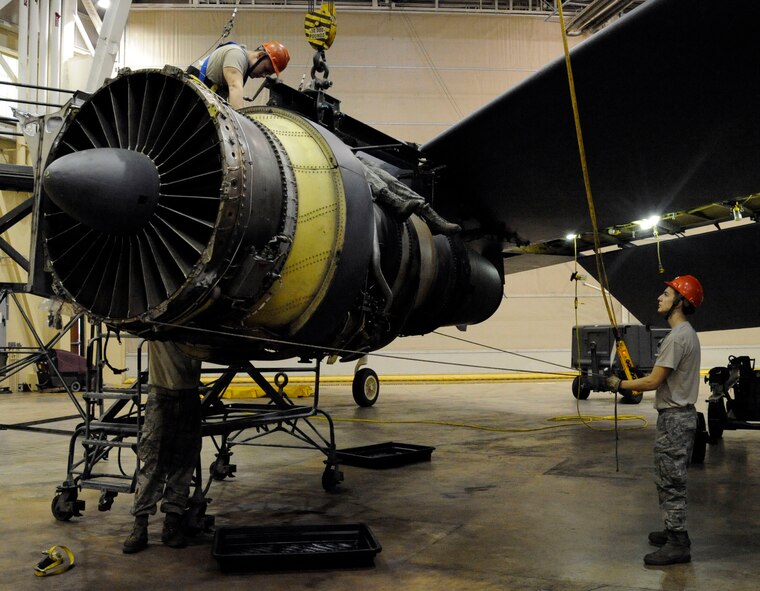 Airmen assigned to the 2nd Maintenance Squadron remove an engine from a B-52H Stratofortress during a phase inspection on Barksdale Air Force Base, La., Jan. 28. Aircraft come in for phase inspections every 450 flight hours. The inspections also include repairs to the aircraft's systems, such as the engines, electrical and life support systems, and hydraulics. (U.S. Air Force photo/Airman 1st Class Andrew Moua)