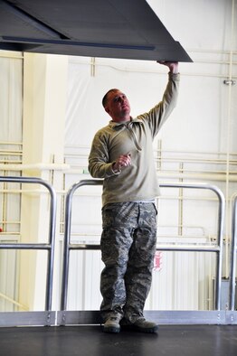 Master Sgt. Jason Lawson, 507th Air Refueling Wing maintenance squadron checks the distance between the new KC-135 maintenance platforms and the wing of a KC-135.  The new platforms are expected to increase safety during Isochronal Inspections while decreasing inspection time.  (Photo by Senior Airman Mark Hybers)