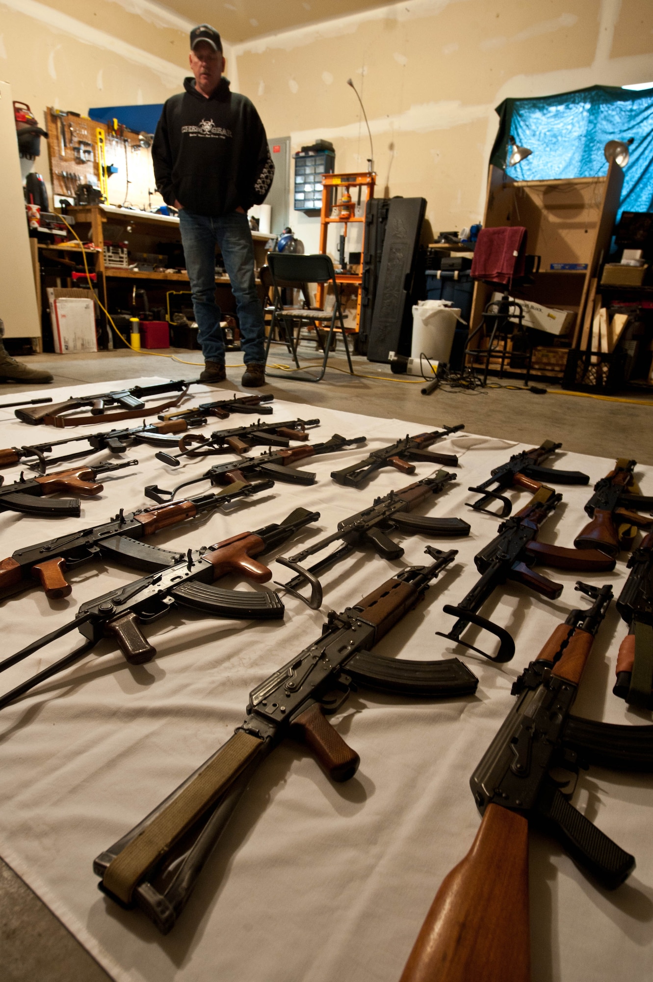 Master Sgt. Monte Ealy, 28th Civil Engineer readiness and emergency management NCO in charge, displays his collection of rifles he’s built from the ground up in Rapid City, S.D., Dec. 11, 2012. Ealy has honed his craft over the past seven years and has completed 24 rifles. (U.S. Air Force photo by Airman 1st Class Zachary Hada/Released)