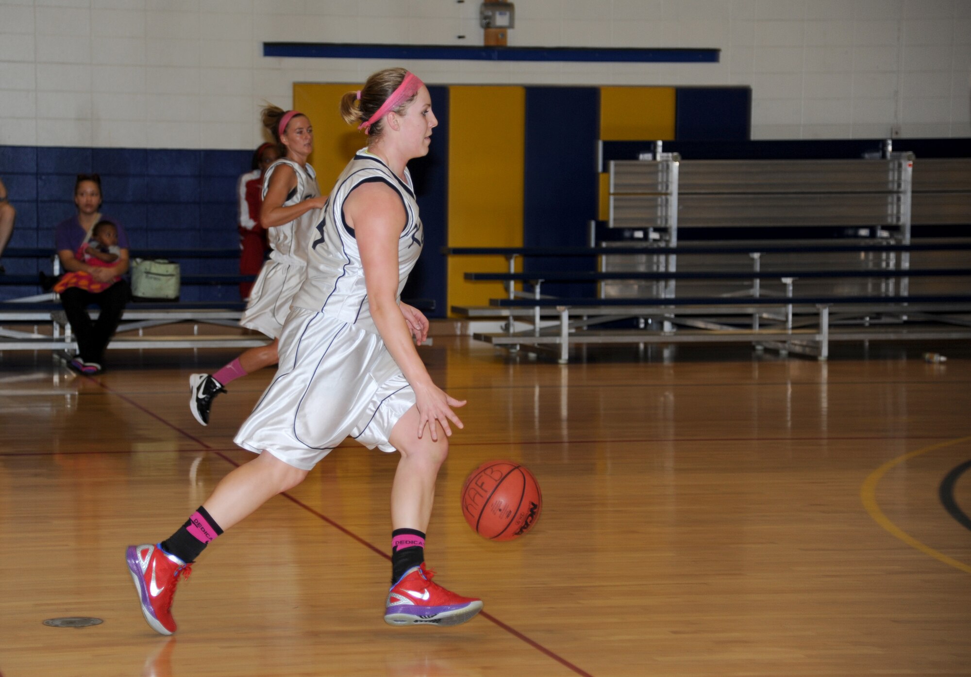 Sarah Newbauer, Keesler, dribbles the ball down court during a women’s varsity basketball game against Eglin Air Force Base, Fla., Jan. 26, 2013, at the Blake Fitness Center, Keesler Air Force Base, Miss.  Keesler defeated Eglin, 85-42.  (U.S. Air Force photo by Kemberly Groue)