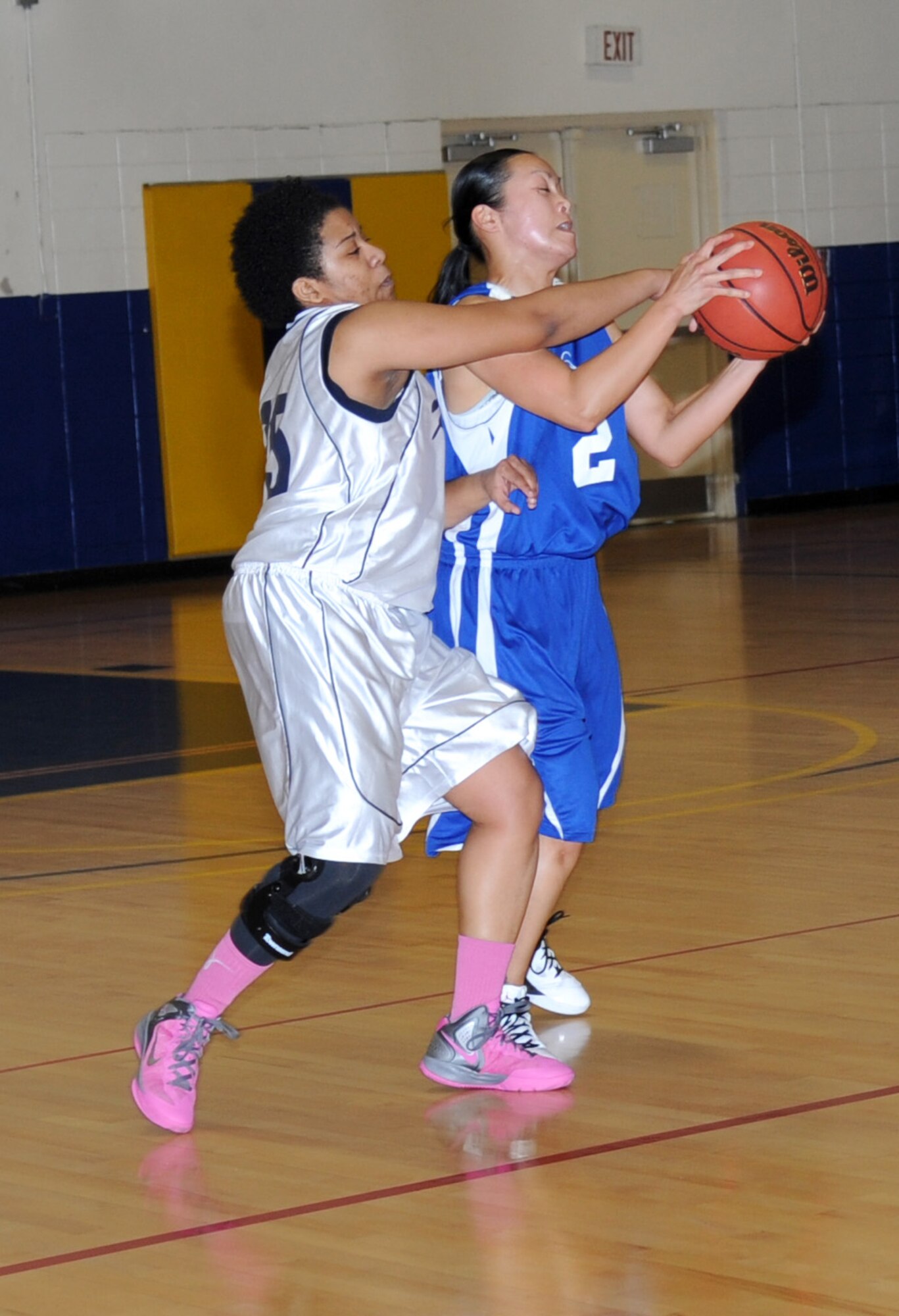 Wyleeshia Meekins, Keesler, attempts to steal the ball from Charlene Lane, Eglin Air Force Base, Fla., during a women’s varsity basketball game Jan. 26, 2013, at the Blake Fitness Center, Keesler Air Force Base, Miss.  Keesler defeated Eglin, 85-42.  (U.S. Air Force photo by Kemberly Groue)