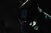 MINOT AIR FORCE BASE, N.D. – Airman 1st Class David Moore, 5th Maintenance Squadron metals technician puts on his protective gear here, Jan. 17. When flight line maintainers notice structural discrepancies with an aircraft, metals technicians go to the aircraft and evaluate the problem. (U.S. Air Force photo/Senior Airman Brittany Y. Auld)