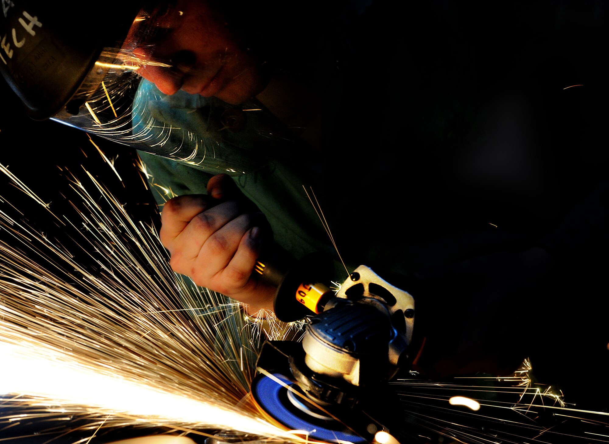 MINOT AIR FORCE BASE, N.D. – Airman 1st Class David Moore, 5th Maintenance Squadron metals technician, welds a piece of damaged equipment here, Jan. 17. The 5th MXS’s  Metals Technology Flight uses a lathe, drill press, torch and imagination to repair, and at times create, parts that are no longer in production. (U.S. Air Force photo/Senior Airman Brittany Y. Auld)