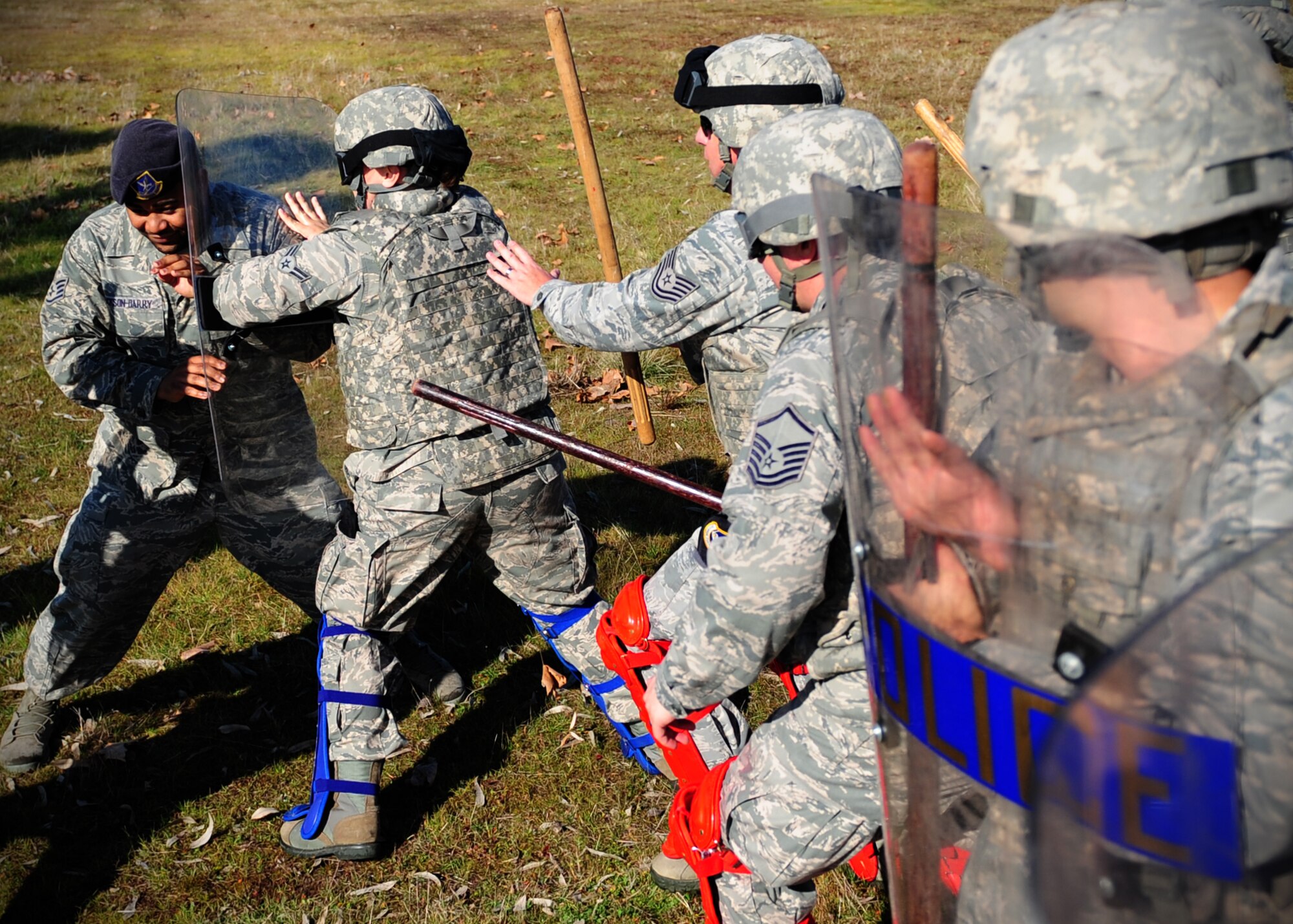 Patrolmen from the 9th Security Forces Squadron subdue a simulated suspect during civil disturbance training at Beale Air Force Base, Calif., Jan. 25, 2013. The squadron trains constantly to stay proficient in base defense. (U.S. Air Force photo by Senior Airman Shawn Nickel/Released)