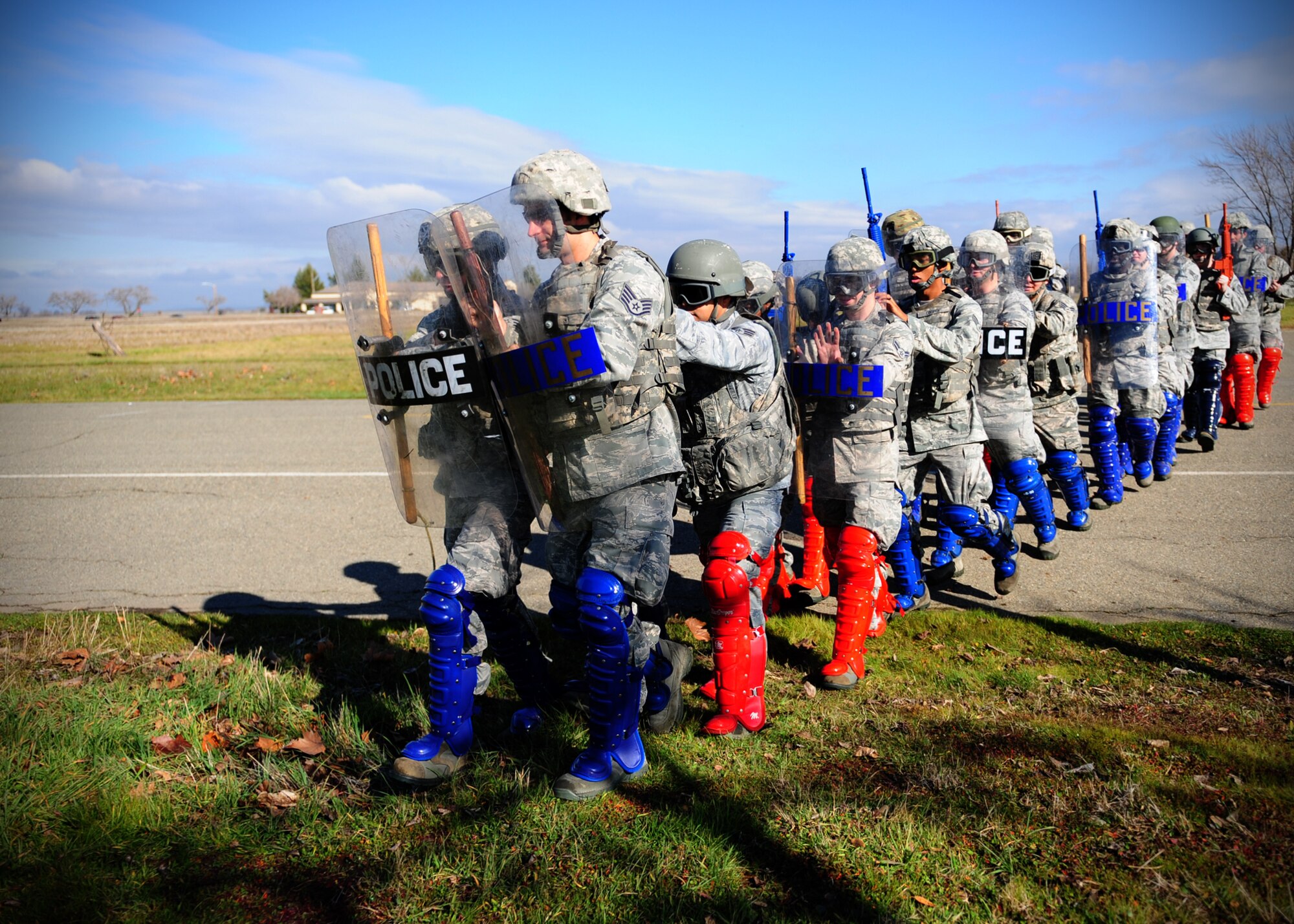 Patrolmen from the 9th Security Forces Squadron march to a simulated disturbance during training at Beale Air Force Base, Calif., Jan. 25, 2013. 9th SFS officers train to be experts in civil disturbance response. (U.S. Air Force photo by Senior Airman Shawn Nickel/Released)