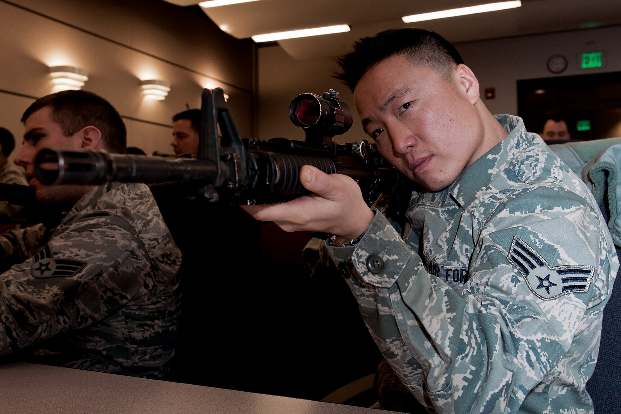 Senior Airman Chris Park, 35th Aerial Port Squadron, takes aim with an M4 rifle during a weapons familiarization class taught by Airmen of the 514th Security Forces Squadron here Jan. 27. In July, the Airmen will be inspected on their ability to survive and operate in hostile conditions, and weapons care and handling will represent a significant part of the inspection. (U.S. Air Force photo by Shawn J. Jones)