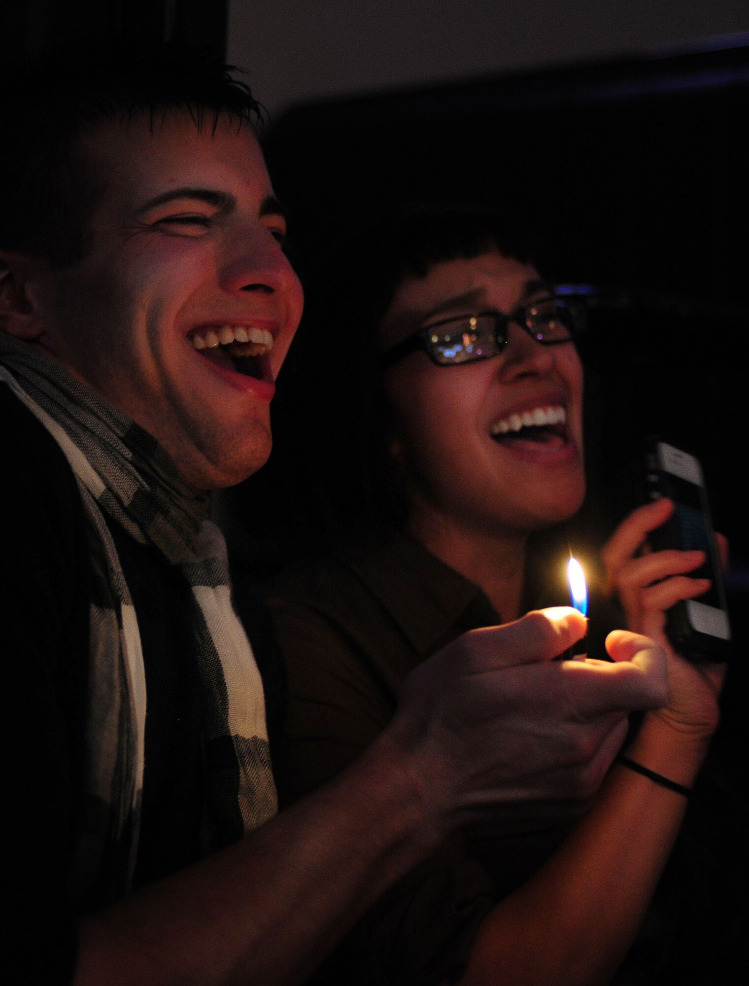 Audience members sing along with Max Impact, the Air Force’s premier rock band, during the show at the Drop Zone at Cannon Air Force Base, N.M., Jan. 26, 2013. Max Impact travels to Air Force bases and deployed locations all over the world, showcasing the Air Force’s excellence through their music. (U.S. Air Force photo/Airman 1st Class Ericka Engblom)