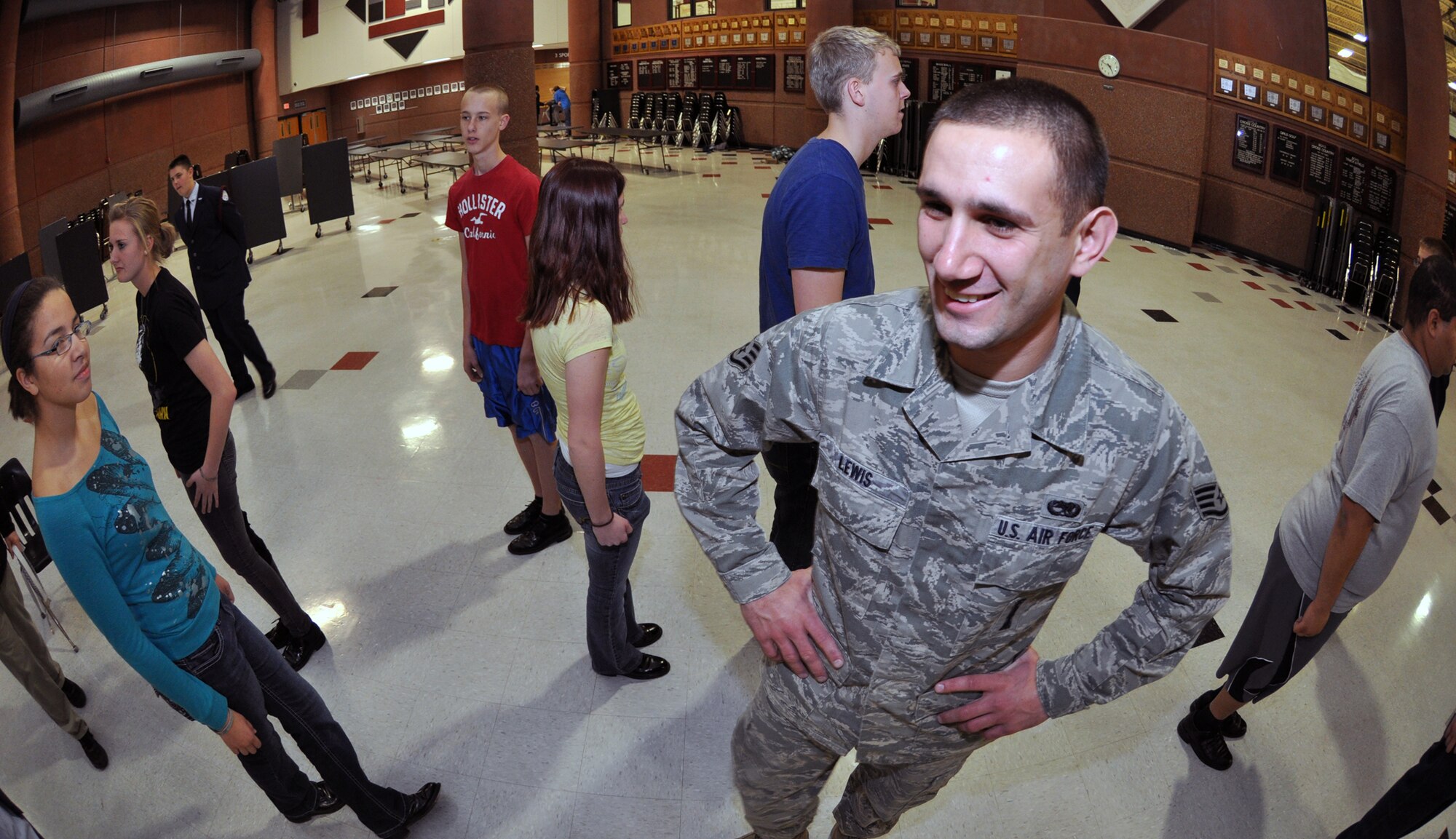 Staff Sgt. Travis Lewis, 509th Bomb Wing Honor Guard assistant noncommisssioned officer in charge, observes students of the Lee's Summit North High School Air Force Junior Reserve Officers' Training Corps during a marching exercise on Jan. 24, 2013. Lewis travels there several times a week to help train the school's AFJROTC program in drill and ceremony. Lewis is a traditional reservist with the 442nd Aircraft Maintenance Squadron, which is part of the 442nd Fighter Wing, an A-10 Thunderbolt II Air Force Reserve unit at Whiteman Air Force Base, Mo. (U.S. Air Force photo by Senior Airman Wesley Wright/released) 
 
