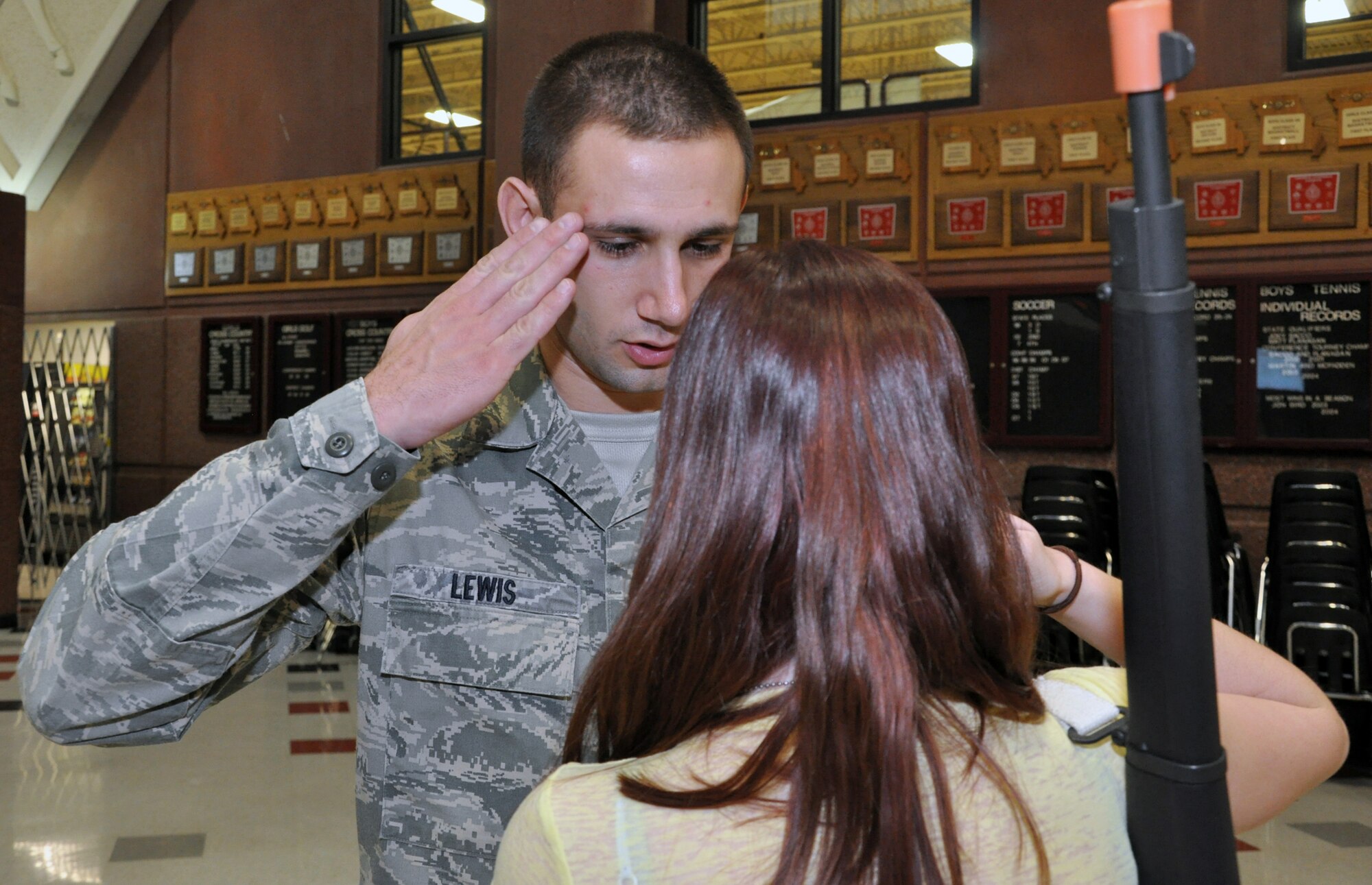 Staff Sgt. Travis Lewis, 509th Bomb Wing Honor Guard assistant noncommisssioned officer in charge, returns a salute from a member of the Lee's Summit North High School Air Force Junior Reserve Officers' Training Corps on Jan. 24, 2013. Lewis travels there several times a week to help train the school's AFJROTC program in drill and ceremony. Lewis is a traditional reservist with the 442nd Aircraft Maintenance Squadron, which is part of the 442nd Fighter Wing, an A-10 Thunderbolt II Air Force Reserve unit at Whiteman Air Force Base, Mo. (U.S. Air Force photo by Senior Airman Wesley Wright/released)