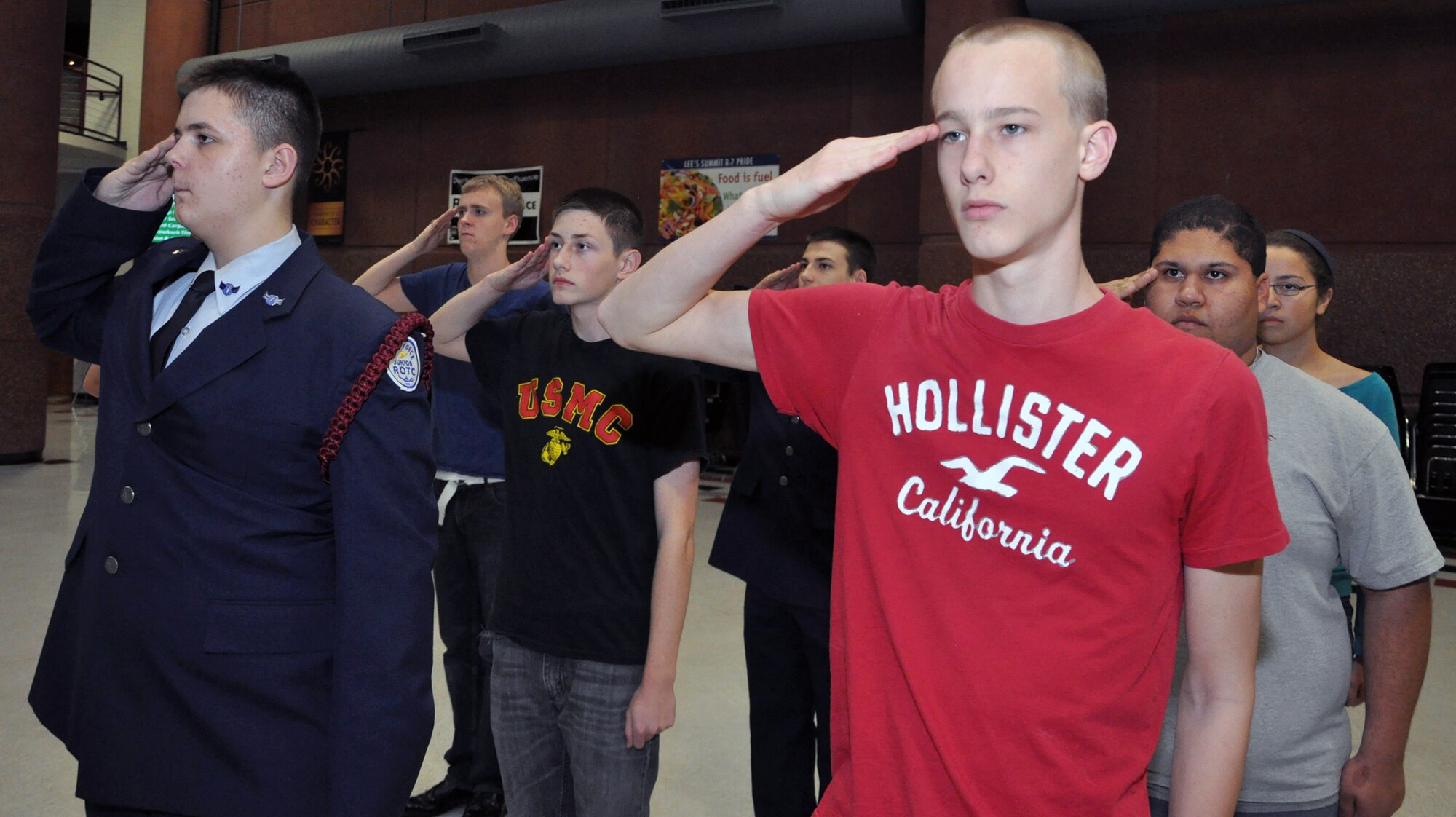 Lee's Summit North High School students form up and salute on Jan. 24, 2012.  Staff Sgt. Travis Lewis, 509th Bomb Wing Honor Guard assistant noncommisssioned officer in charge, travels there several times a week to help train the school's Air Force Junior Reserve Officers' Training Corps in drill and ceremony. Lewis is a traditional reservist with the 442nd Aircraft Maintenance Squadron, which is part of the 442nd Fighter Wing, an A-10 Thunderbolt II Air Force Reserve unit at Whiteman Air Force Base, Mo. (U.S. Air Force photo by Senior Airman Wesley Wright/released)