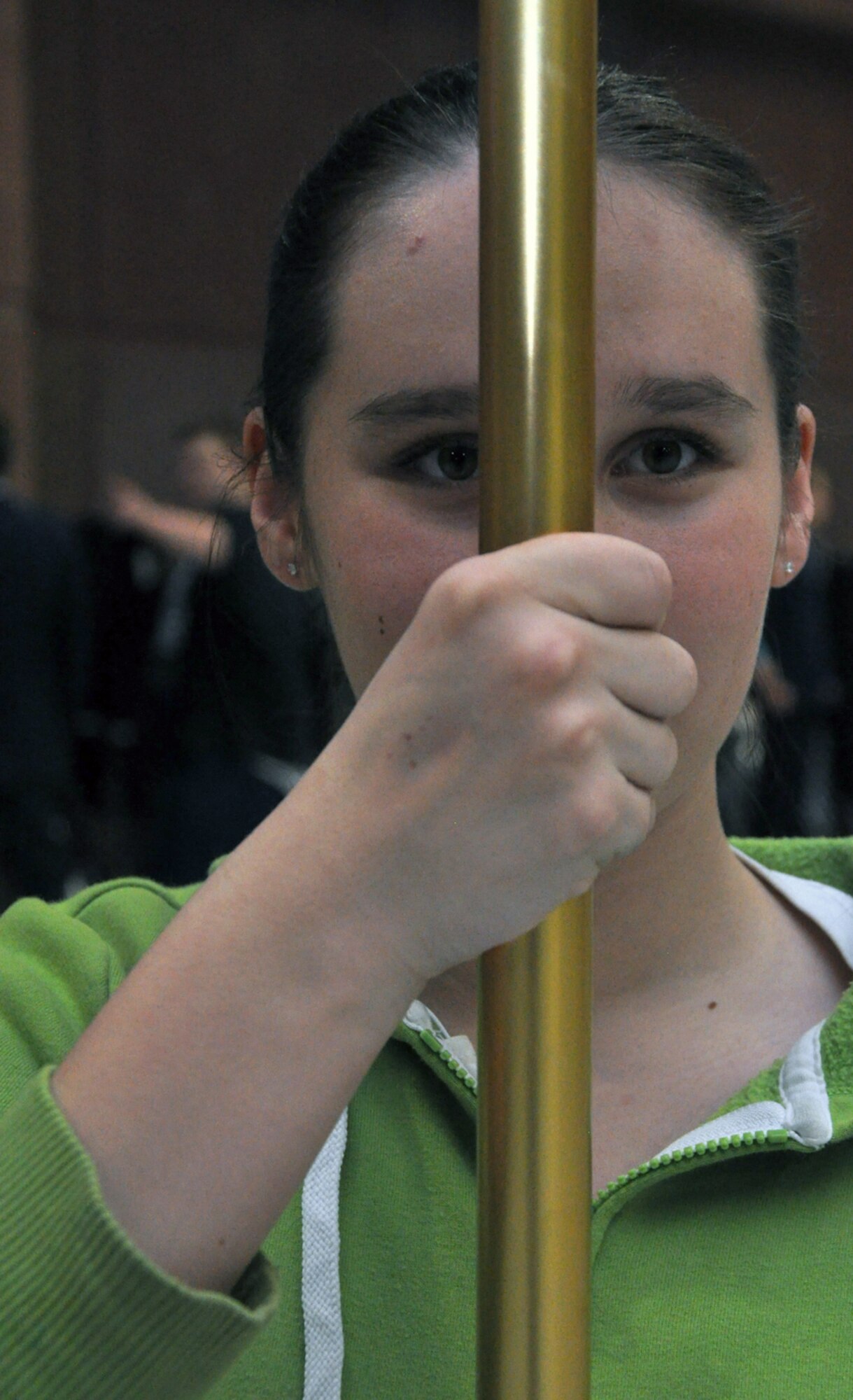 A Lee's Summit North High School student practices color guard on Jan. 24, 2012.  Staff Sgt. Travis Lewis, 509th Bomb Wing Honor Guard assistant noncommisssioned officer in charge, travels there several times a week to help train the school's Air Force Junior Reserve Officers' Training Corps in drill and ceremony. Lewis is a traditional reservist with the 442nd Aircraft Maintenance Squadron, which is part of the 442nd Fighter Wing, an A-10 Thunderbolt II Air Force Reserve unit at Whiteman Air Force Base, Mo. (U.S. Air Force photo by Senior Airman Wesley Wright/released) 