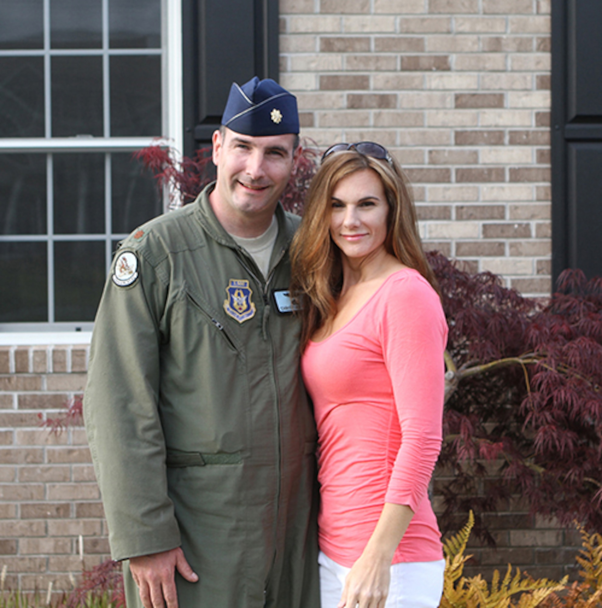 In Magnolia, Del., Dawn Fiore stands with her husband Maj. Christian Fiore, a Reserve pilot assigned to the 326th Airlift Squadron, Dover Air Base, Del., April 30, 2012. For half of their marriage, Dawn had battled multiple sclerosis discreetly until she went public in 2012 in an online feature interview about her battling her disease with fitness and martial arts. (Courtesy photo)