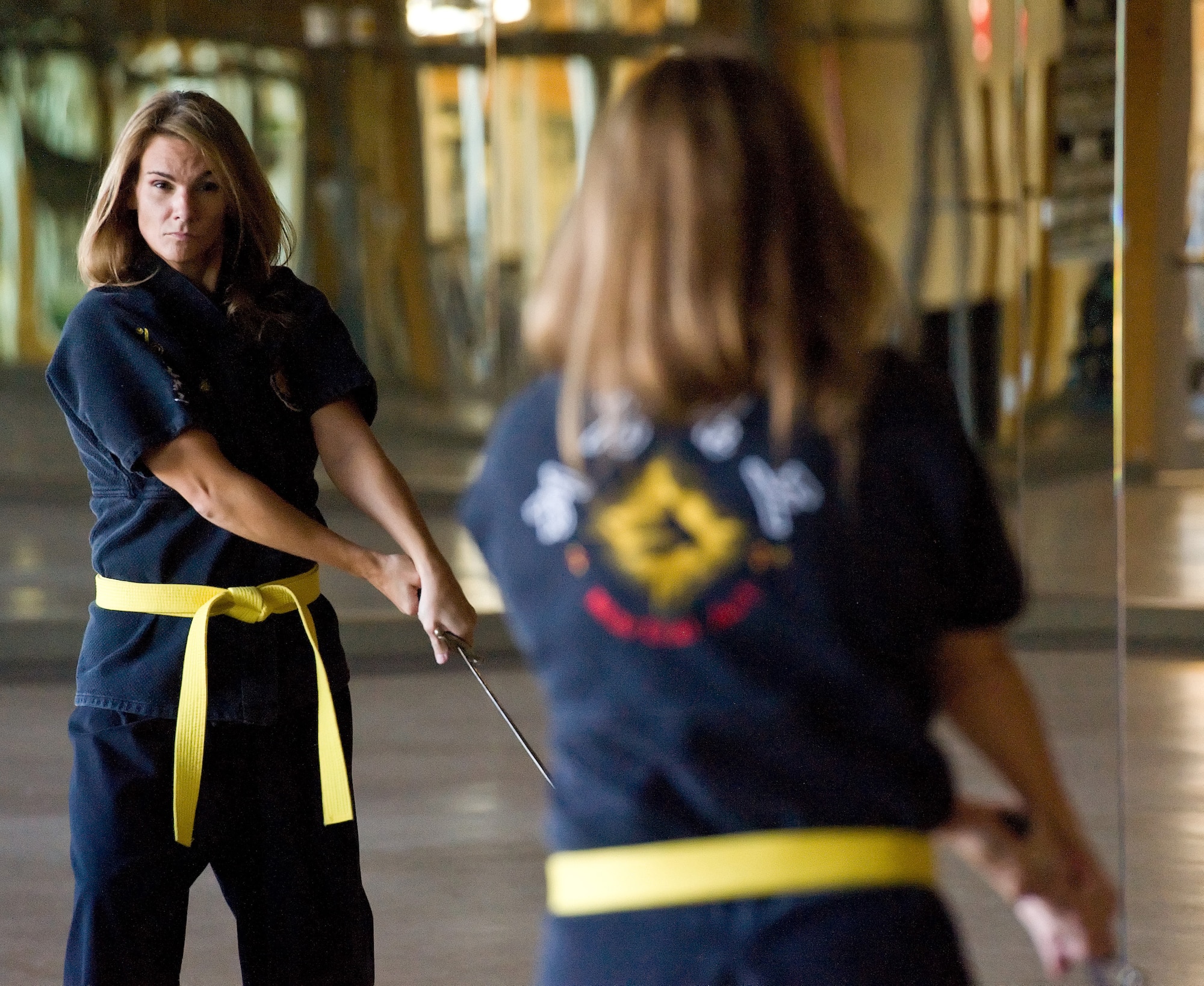 Dawn Fiore, the wife a Reserve pilot assigned to the 326th Airlift Squadron, Dover Air Base, Del., practices Haidong Gumdo Nov. 16, 2012, at the base fitness center. Fiore, who holds a yellow belt in Korean sword fighting and a black belt in Taekowndo, has been battling multiple sclerosis for eight years; she credits martial arts for her multiple sclerosis' lack of progression. (U.S. Air Force photo/Roland Balik)