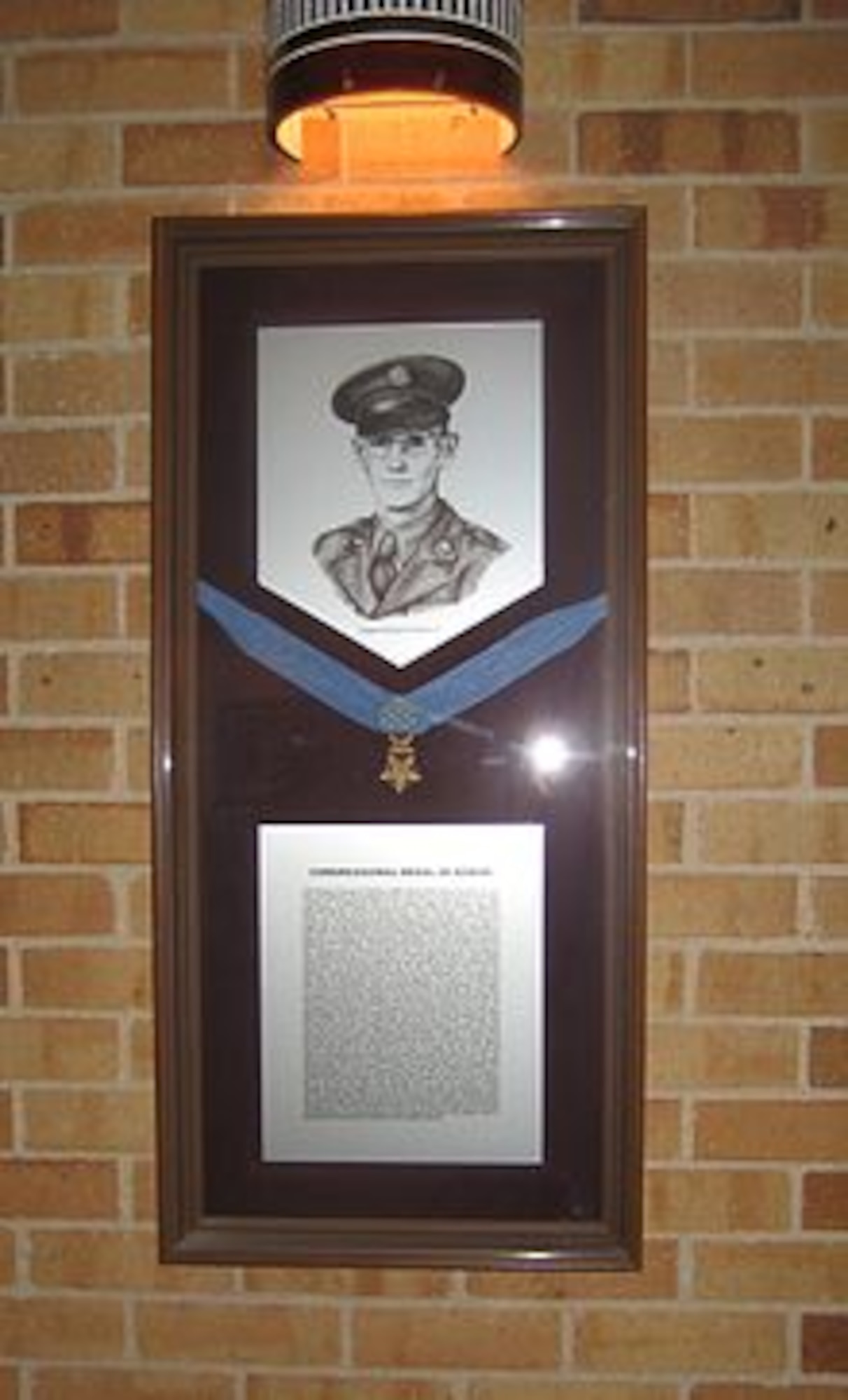The Congressional Medal of Honor awarded to Army Staff Sgt. George Keathley for his heroic actions during World War II hangs proudly on display at Texas A&M University to honor the school graduates service.  The staff sergeant is the great-great uncle of Air Force Tech. Sgt. Derek Keathley, who passes on the legacy of his relative's actions to his current technical training students to help them understand the meaning of sacrifice.  (U.S. Air Force courtesy photo)