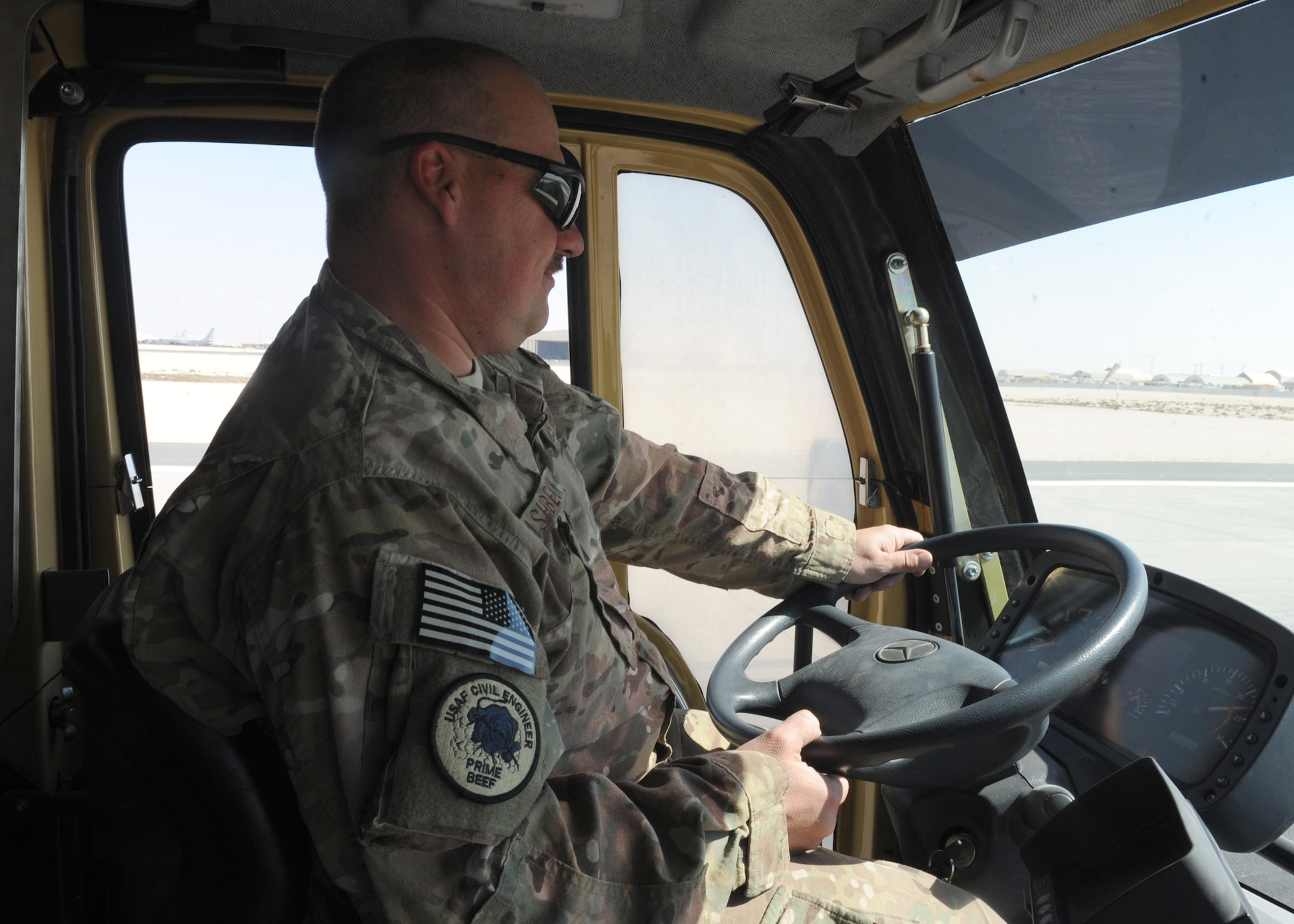 SOUTHWEST ASIA – Tech. Sgt. Anthony Ashbeck, 577th Expeditionary Prime Beef Squadron, receives training on how to remove rubber using a retrofitted Unimog Jan. 18. The Unimog can be transformed into a smaller version of itself, allowing it to be transported in a C-130 to austere airfields in the U.S. Central Command area of responsibility. (U.S. Air Force photo/Senior Airman Joel Mease)
