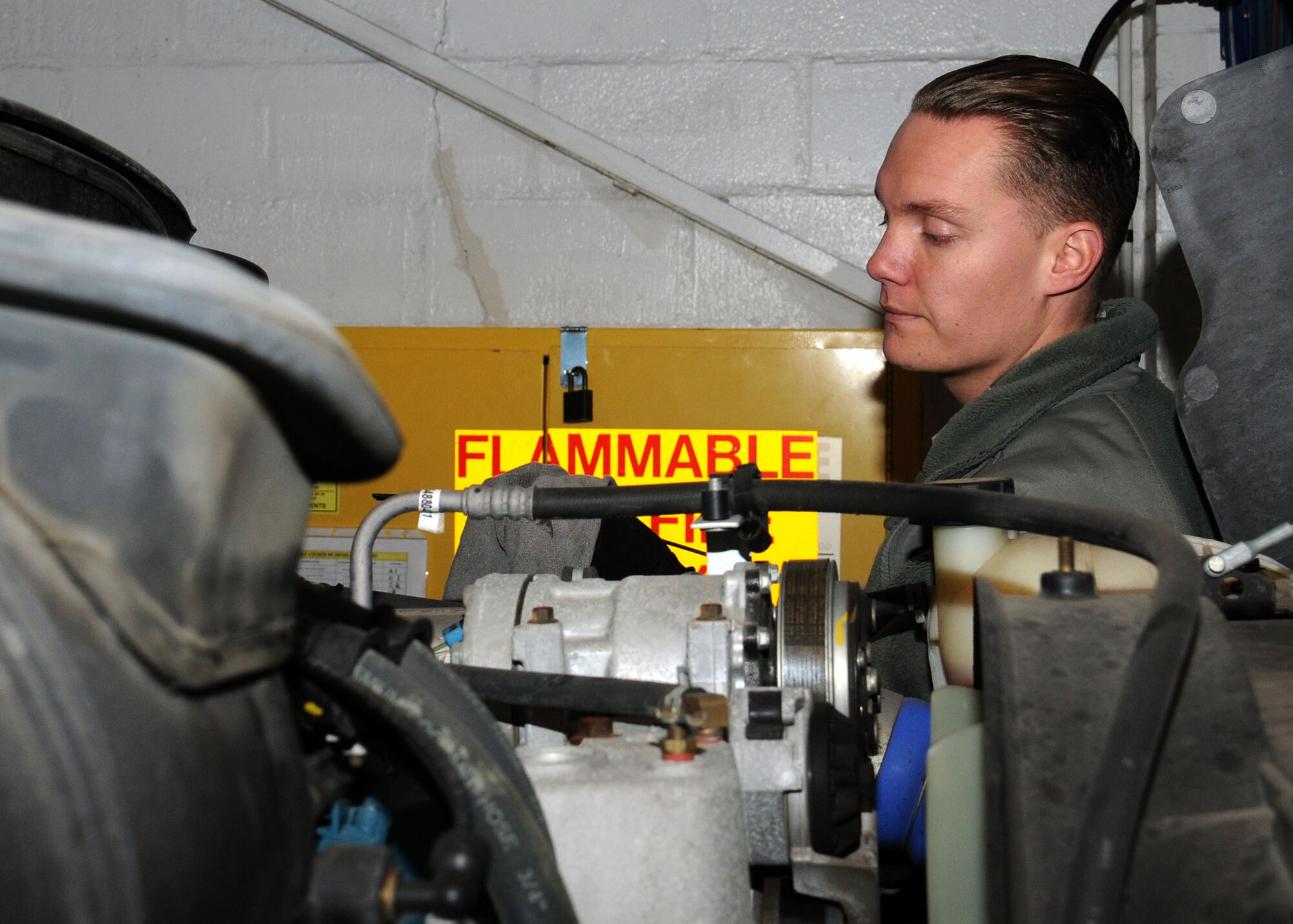 Staff Sgt. Jonathan Spell, 100th Logistics Readiness Squadron refueling maintenance NCO-in-charge from Charleston, S.C., checks the oil in a fuel truck Jan. 25, 2013, at RAF Mildenhall, England. The 100th LRS fuels flight work with vehicle maintenance flight to ensure the assigned nine R-11 mobile refueling trucks, two C-300’s (one is designated for diesel and one for unleaded gasoline), and eight government-owned vehicles (used to transport airmen and supplies around the flightline) are ready for the mission. (U.S. Air Force photo by Gina Randall/Released)