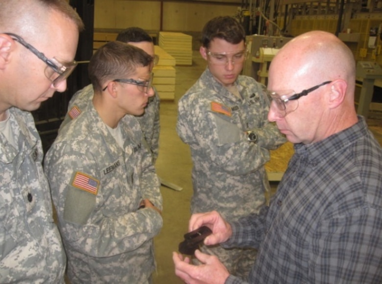 U.S. Military Academy at West Point cadets work on materials for use in their Structural Insulated Panels Hut design.