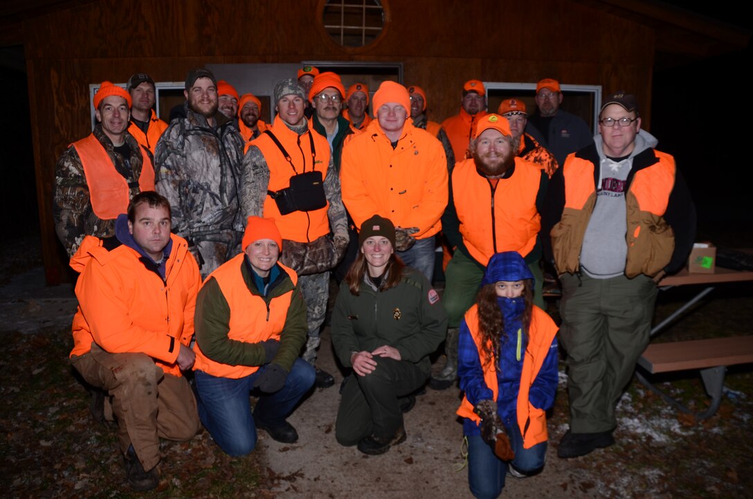 Volunteers from the Wisconsin Department of Natural Resources, or DNR, and the district celebrate with seven wounded warriors following the first warrior deer hunt at Eau Galle Recreation Area, near Spring Valley, Wis., Dec. 8. The hunt was a collaborative effort among the DNR, the district, the Chanhassen Yellow Ribbon Program and the Wounded Warrior Project.