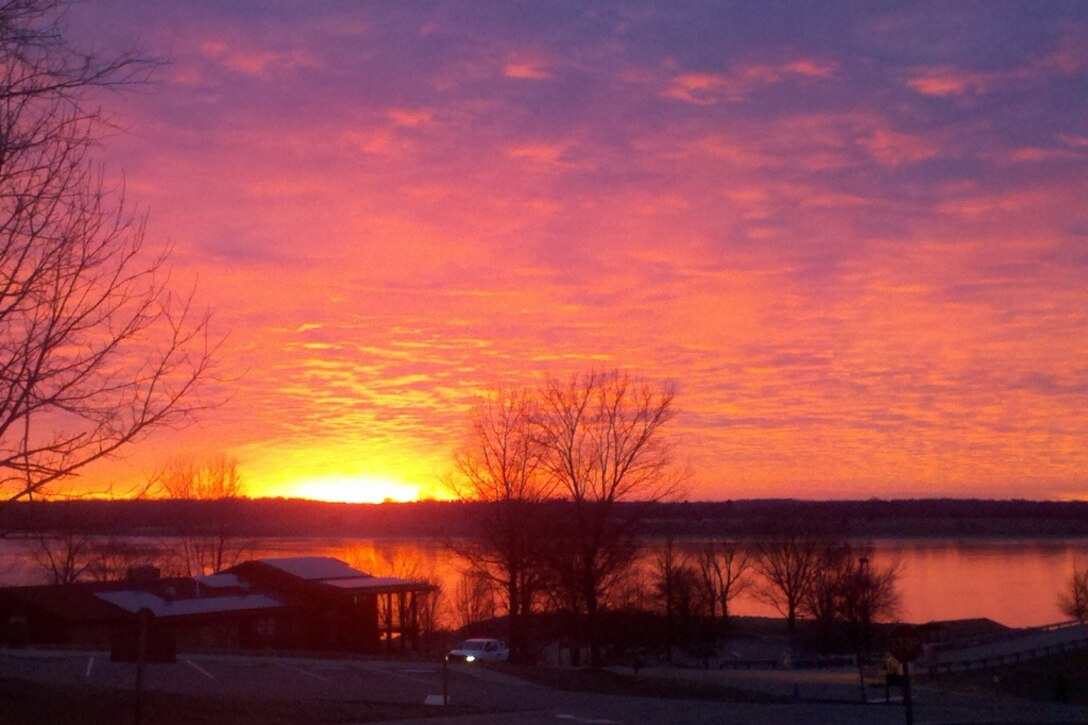 A colorful winter sunrise over the CJ Brown Dam and Reservoir Visitor Center in Sprinfield, Ohio. (U.S. Army Corps of Engineers photo by Brian Menker)