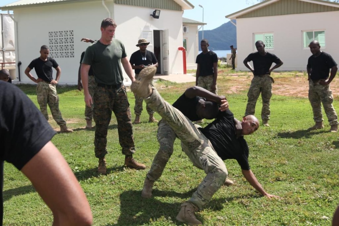 U.S. Marine Staff Sgt. Joshua Perry, Special Purpose Marine Air-Ground Task Force 13.1, Marine Forces Africa instructor, teaches martial arts to members of the Seychelles People's Defense Force Tazar Special Forces Unit Dec. 3-7, 2012, at Sans Souci, Seychelles. The Marines and SPDF Tazar Special Forces partnered to enhance the SPDF's capabilities in conducting counter-piracy operations. The engagement also helped build and sustain the relationship between U.S. and Seychelles military forces. 