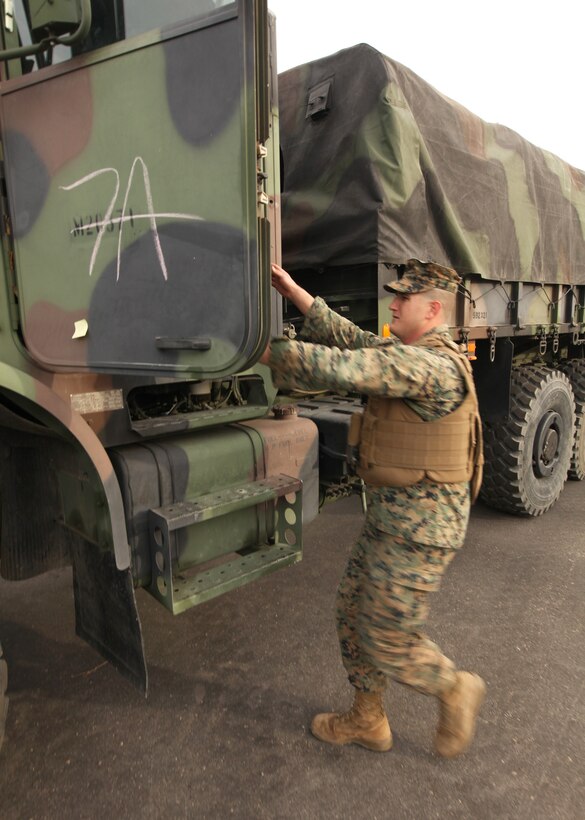 Lance Cpl. Lawrence Begnoche, a motor transport operator with 1st Intelligence Battalion prepares to embark on a convoy to support Exercise Dawn Blitz 13.1, at Camp Pendleton, Calif., Jan. 23. The Marines with 1st Intel Bn., and 9th Communication Battalion, will establish communications and an intelligence operations center for the nine-day exercise to validate their readiness and ability to support 1st Marine Expeditionary Brigade in the event of a contingency. Begnoche, 25, is from West Palm Beach, Fla.


