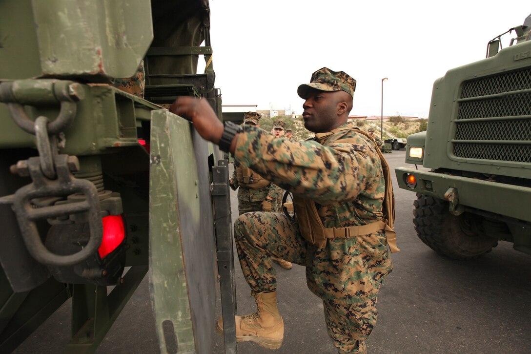 Staff Sgt. Osumanu Saku, the 1st Intelligence Battalion collections chief, climbs aboard a tactical vehicle to embark on a convoy to support Exercise Dawn Blitz 13.1, at Camp Pendleton, Calif., Jan. 23. The Marines with 1st Intel Bn., and 9th Communication Battalion, will establish communications and an intelligence operations center for the nine-day exercise to validate their readiness and ability to support 1st Marine Expeditionary Brigade in the event of a contingency. Saku, 29, is from Bronx, N.Y.


