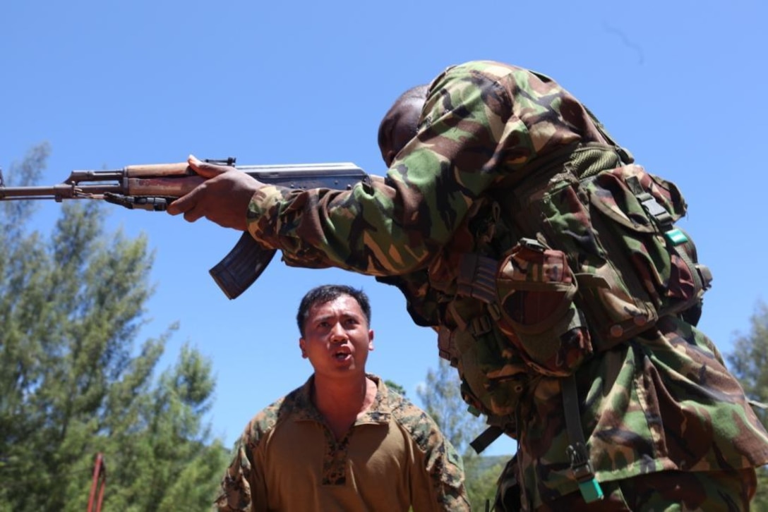 U.S. Marine Sgt. Vanderbilt Gaditano, Special Purpose Marine Air-Ground Task Force 13.1, Marine Forces Africa instructor, teaches weapons drills to members of the Seychelles People's Defense Force Tazar Special Forces Unit Dec. 3-7, 2012, at Sans Souci, Seychelles. The Marines and SPDF Tazar Special Forces partnered to enhance the SPDF's capabilities in conducting counter-piracy operations. The engagement also helped build and sustain the relationship between U.S. and Seychelles military forces.