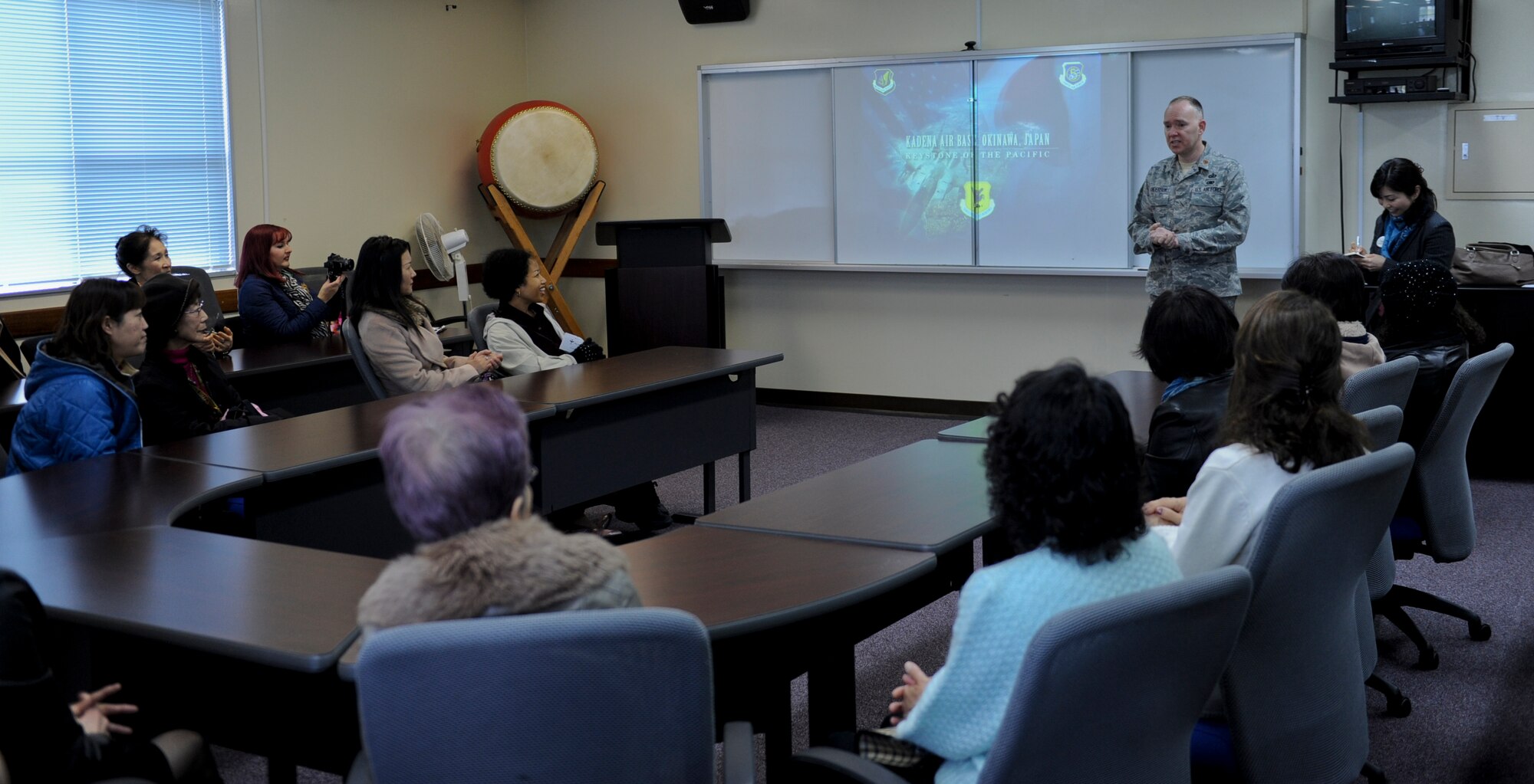 U.S. Air Force Maj. Christopher Anderson, 18th Wing chief of Public Affairs, speaks with the Okinawa International Women's Club during a base tour on Kadena Air Base, Japan, Jan. 28, 2013. More than 30 club members came to Kadena to gain insight and a better understanding of the 18th Wing's mission. (U.S. Air Force photo/Airman 1st Class Justin Veazie)