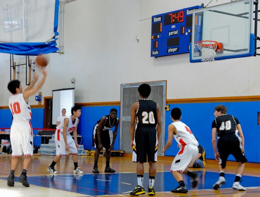 A member from the Chatan High School basketball team shoots a free-throw during the Okinawan-American Friendship Tournament at the Risner Fitness Center on Kadena Air Base, Japan, Jan. 26, 2013. The tournament was a way to show how the two different cultures play the sport and interact with each other. (U.S. Air Force photo/Airman 1st Class Justin Veazie)