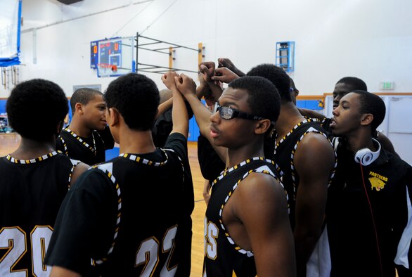 The Kadena High School varsity basketball team gets pumped up during the Okinawan-American Friendship Tournament at the Risner Fitness Center on Kadena Air Base, Japan, Jan. 26, 2013. The tournament was for American and Japanese players to come together in fellowship and speak the national language of basketball. It was sponsored by the U.S. Consulate and Department of Defense Education Activity Okinawa District schools. (U.S. Air Force photo/Airman 1st Class Justin Veazie)