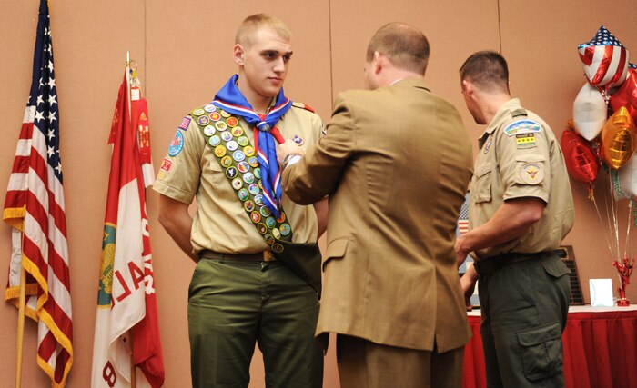 Col. Phil Stewart, 9th Reconnaissance Wing commander, awards Airman 1st Class Robert Severson, 9th Maintenance Squadron crew chief the rank of Eagle Scout during a dinner at the Recce Point Club on Beale Air Force Base Calif., Jan. 26.  The event was held to celebrate the 50th anniversary of Troop 44 of the Boy Scouts of America.  Stewart earned the rank of Eagle Scout in 1988. (U.S. Air Force photo by Airman 1st Class Bobby Cummings/Released)