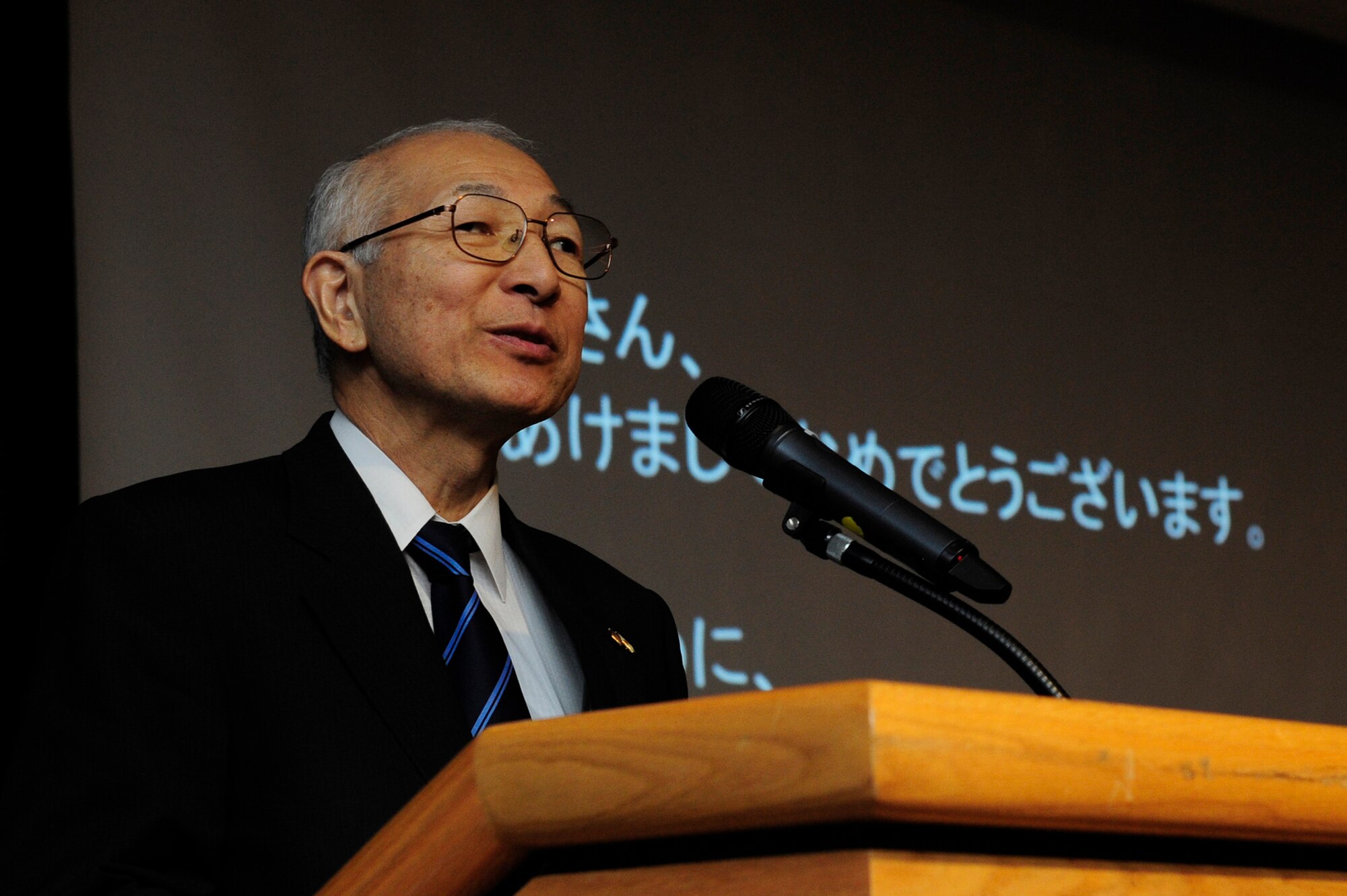Tadashi Takagi, president of the Ome-Yokota Friendship Club, delivers remarks during the a New Year's celebration hosted at Yokota Air Base, Japan, Jan. 26, 2013. Yokota hosted the event to help strengthen U.S. and Japanese relations throughout the local communities and to thank local organizations for their support during the year. (U.S. Air Force photo by 2nd Lt. Jake Bailey)