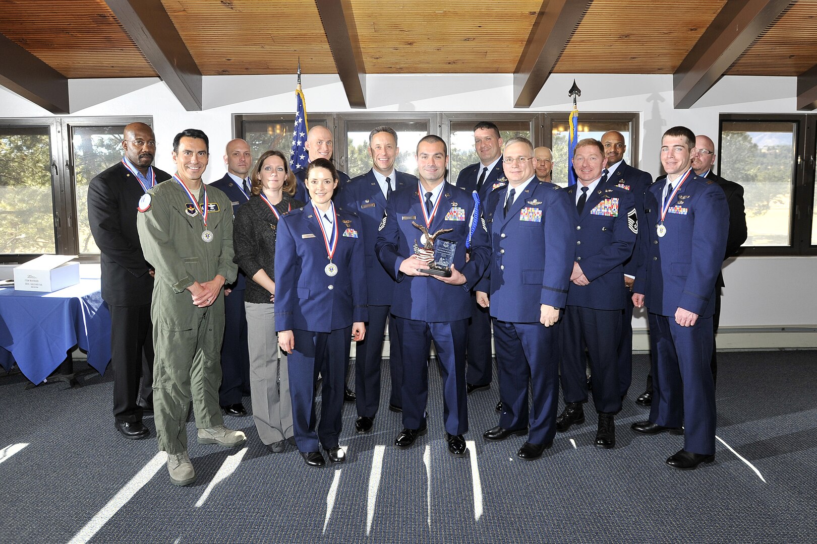 Annual award nominees from the 12th Flying Training WIng's 306th Flying Training Group pose for a photo with 12th FTW leadership after the ceremony at the U.S. Air Force Academy, Colo., January 28, 2013.  Due to its geographically separated nature, members of the wing's 306th and 479th Flying Training Groups were not able to attend the wing's formal banquet held at Joint Base San Antonio-Randolph, Texas January 25.  Instead they were honored at individual events at their respective home stations, the U.S. Air Force Academy, Colo., and Naval Air Station Pensacola, Fla. on January 28 and 29.  Typically all nominees are sent TDY to the ceremony, but having separate events saved the wing nearly $30,000.