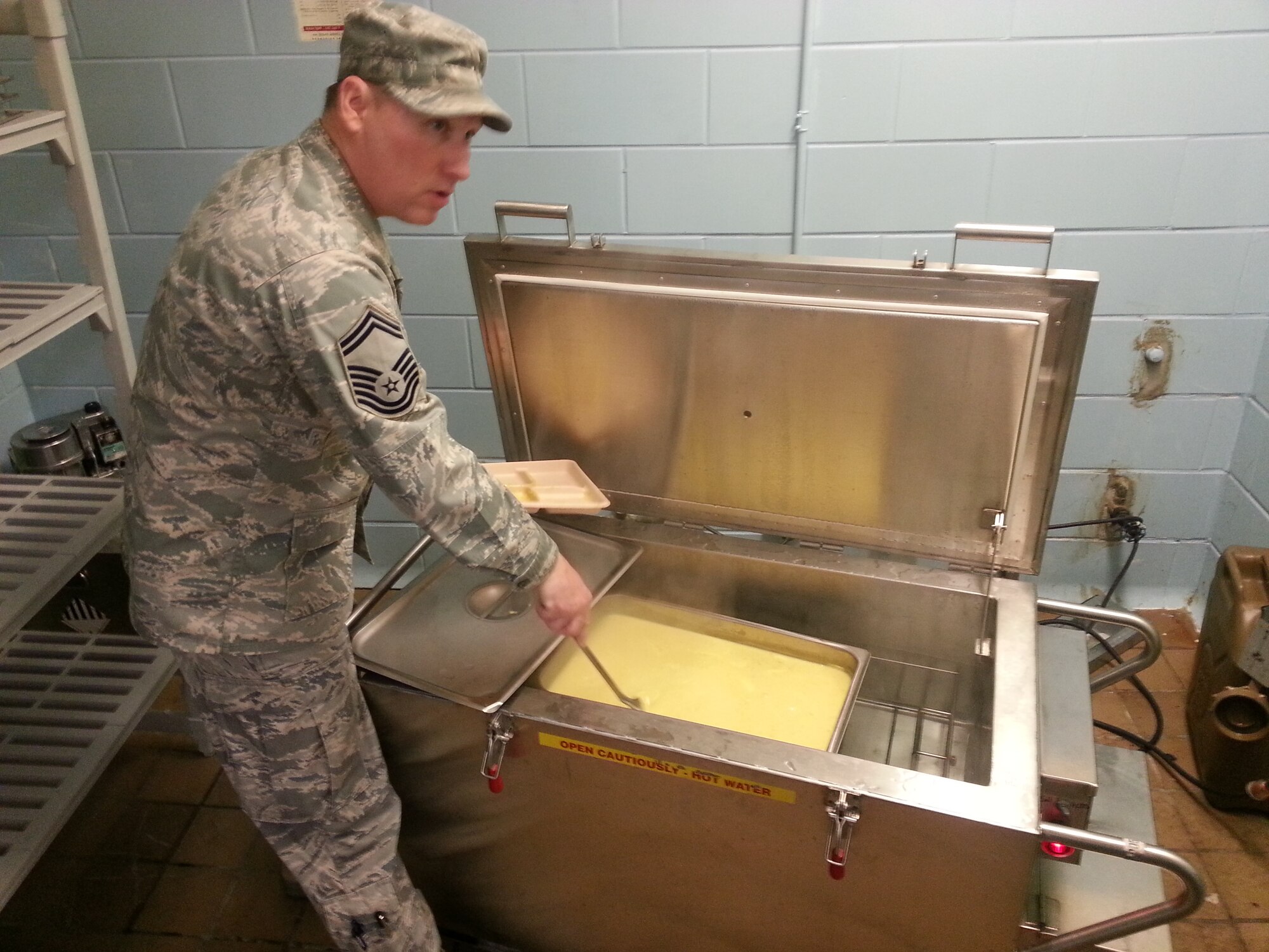 Senior Master Sgt. Scott Balko of the 152nd Sustainment Services Flight prepares eggs for Tennessee National Guard members while supporting the 2013 Presidential inauguration.  Balko was one of nine High Rollers who traveled to the District of Columbia for the ceremony.  USAF Photo by David Hill (released).