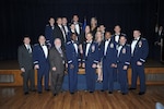 Annual award winners from the 12th Flying Training WIng's 12th Operations Group and 12th Maintenance Directorate pose for a photo with Gen. Edward Rice, Air Education and Training Command commander (center), and 12th FTW leadership after receiving their awards at the Parr O'Club at Joint Base San Antonio-Randolph, Texas, January 25, 2013.  Due to the geographically separated nature of the 12th FTW, members stationed with the wing's 306th and 479th Flying Training Groups were not able to attend the event.  Instead they were honored at individual events at their respective home stations, the U.S. Air Force Academy, Colo., and Naval Air Station Pensacola, Fla., on January 28 and 29.  Typically all nominees are sent TDY to the ceremony, but having separate events saved the wing nearly $30,000.