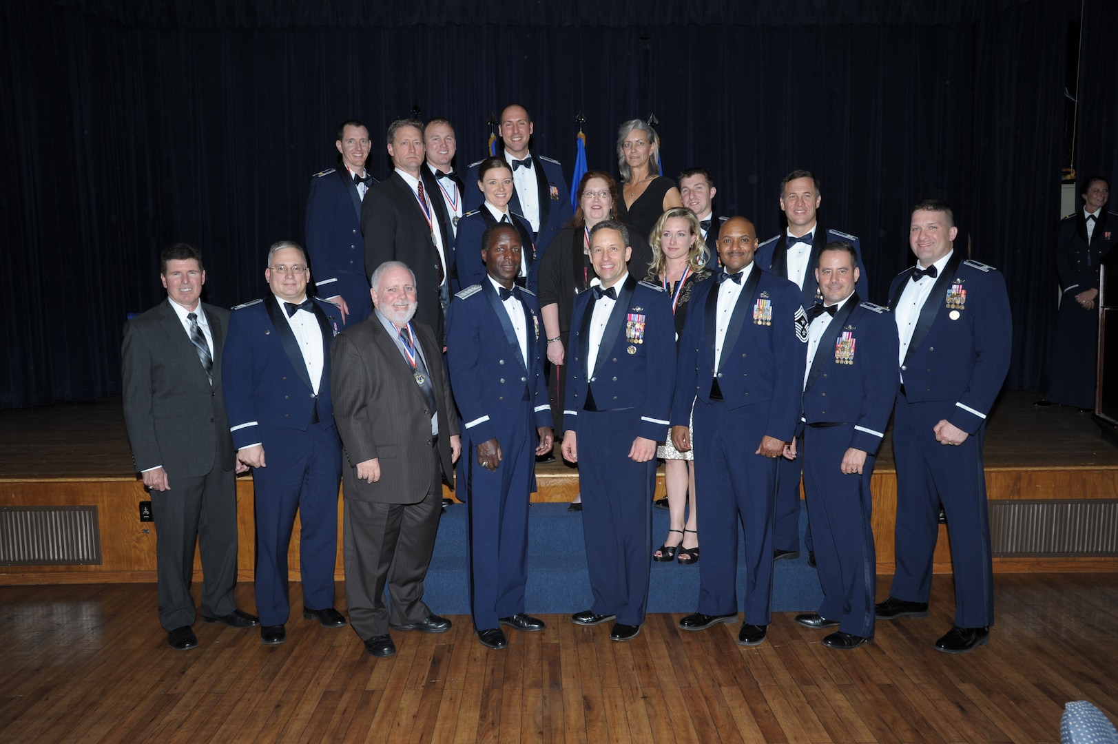 Annual award winners from the 12th Flying Training WIng's 12th Operations Group and 12th Maintenance Directorate pose for a photo with Gen. Edward Rice, Air Education and Training Command commander (center), and 12th FTW leadership after receiving their awards at the Parr O'Club at Joint Base San Antonio-Randolph, Texas, January 25, 2013.  Due to the geographically separated nature of the 12th FTW, members stationed with the wing's 306th and 479th Flying Training Groups were not able to attend the event.  Instead they were honored at individual events at their respective home stations, the U.S. Air Force Academy, Colo., and Naval Air Station Pensacola, Fla., on January 28 and 29.  Typically all nominees are sent TDY to the ceremony, but having separate events saved the wing nearly $30,000.