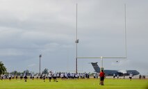 National Football League Pro Bowl players meet for a special practice at Earhart Field, Joint Base Pearl Harbor-Hickam, Hawaii, Jan. 24, 2013. The National Football Conference and the American Football Conference practiced in front of thousands of military service members and their families in preparation for Sunday's Pro Bowl. (U.S. Air Force photo/Tech. Sgt. Jerome S. Tayborn)