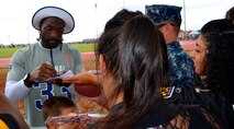 National Football Conference Pro Bowl player Charles Tillman of the Chicago Bears signs autographs for Joint Base Pearl Harbor-Hickam service members and their families’ during the 2013 Pro Bowl practice at the Earhart Field, JBPHH, Hawaii, Jan. 24, 2013.  (U.S. Air Force photo/Tech. Sgt. Jerome S. Tayborn)