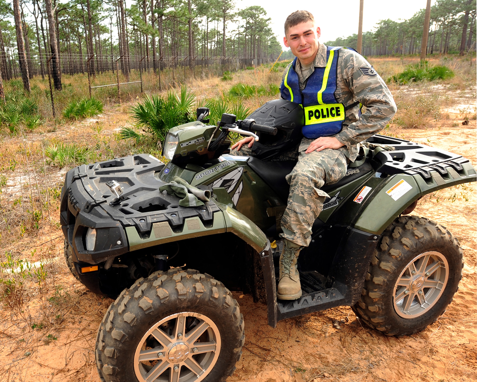 Staff Sgt. Miles Prather, NCO in charge of physical security for 1st Special Operations Security Force Squadron, poses on an All Terrain Vehicle after a routine perimeter check of security fences around Hurlburt Field, Fla., Jan 25, 2013. Prather was selected for this week's Tip of the Spear spotlight. (U.S. Air Force photo by Senior Airman Kentavist P. Brackin)