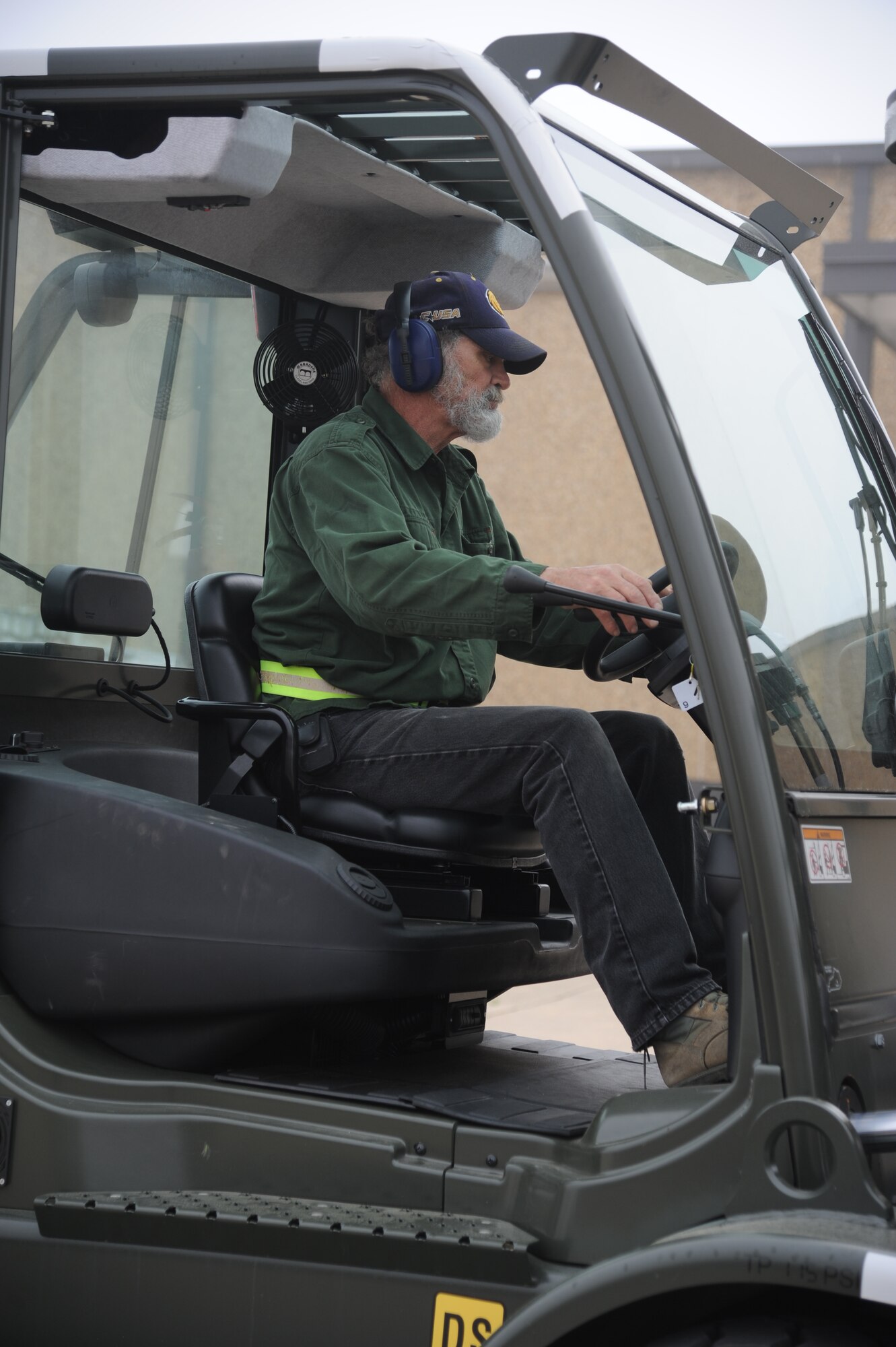 Marc Lerch, 81st Logistics Readiness Squadron, operates a forklift for transporting cargo at the supply warehouse loading docks during a humanitarian deployment exercise Jan. 29, 2013, at the Taylor Logistics Center, Keesler Air Force Base, Miss.  The exercise scenario consists of an earthquake in Arkansas with a warning order for a deployment to Little Rock, Ark.  (U.S. Air Force photo by Kemberly Groue)